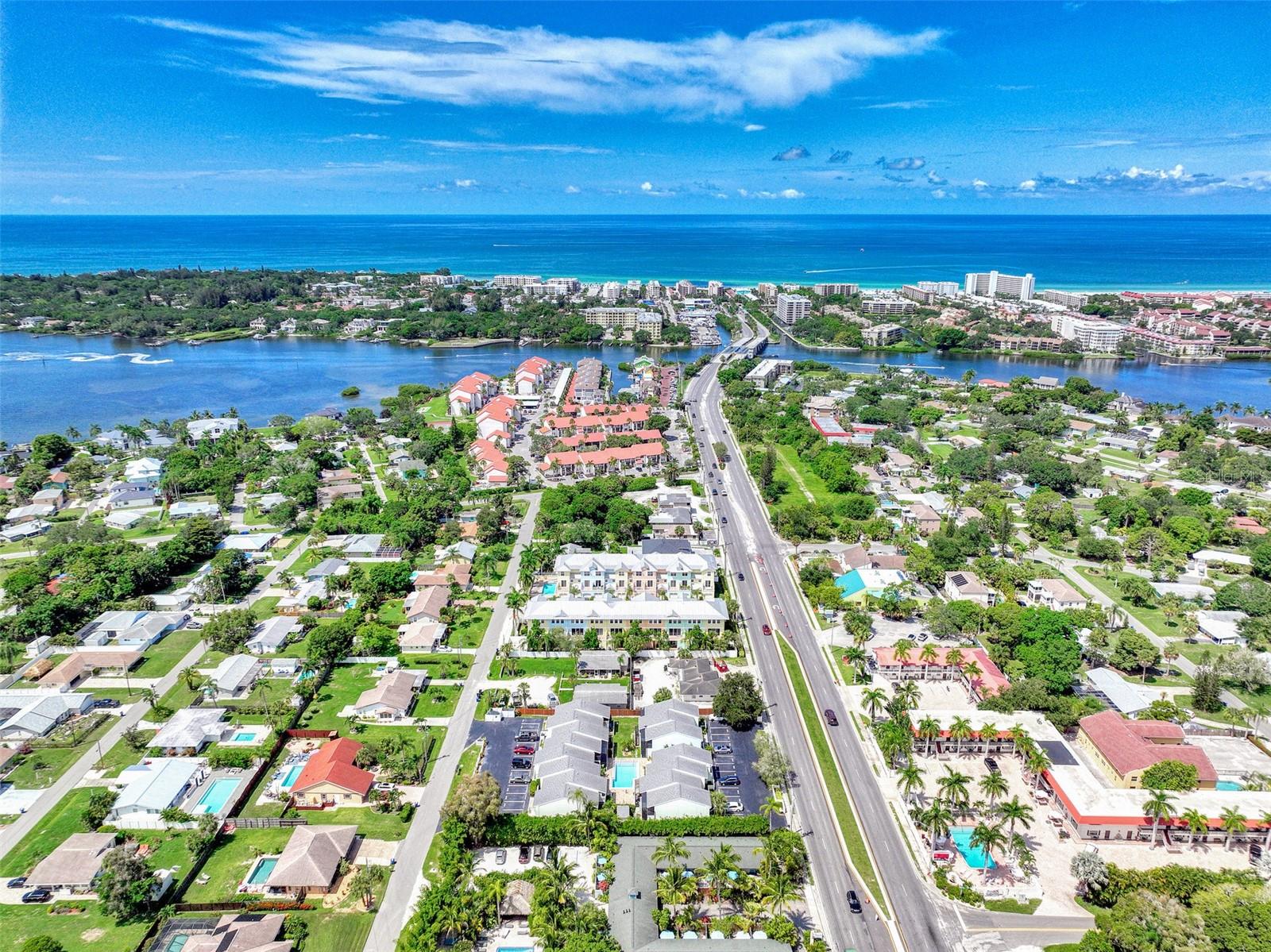 Significant price improvement!  Step into modern luxury with this beautifully renovated 2-bedroom, 1.5-bath townhouse, just moments from Siesta Key. Transformed in 2023, the home features sleek luxury vinyl flooring, updated baseboards, fresh doors, and a show-stopping kitchen with raised ceilings, updated cabinetry, and brand-new appliances. Both bathrooms are elegantly upgraded, and recessed lighting enhances every space.

Enjoy serene outdoor living with a screened lanai on both levels and a new Trex deck. The new A/C system and ceiling fans ensure year-round comfort, while the in-unit washer and dryer add convenience upstairs. Nestled in an exclusive 15-unit complex with a sparkling pool and assigned parking, this home offers a tranquil yet vibrant lifestyle.

Perfect as a seasonal rental, second home, or personal retreat, you'll love the location west of the trail—walking distance to Siesta Key, shopping, and dining, with the exciting Siesta Promenade nearby. Plus, boat storage is just minutes away for your coastal adventures. Don’t miss your chance to own a slice of Sarasota paradise!