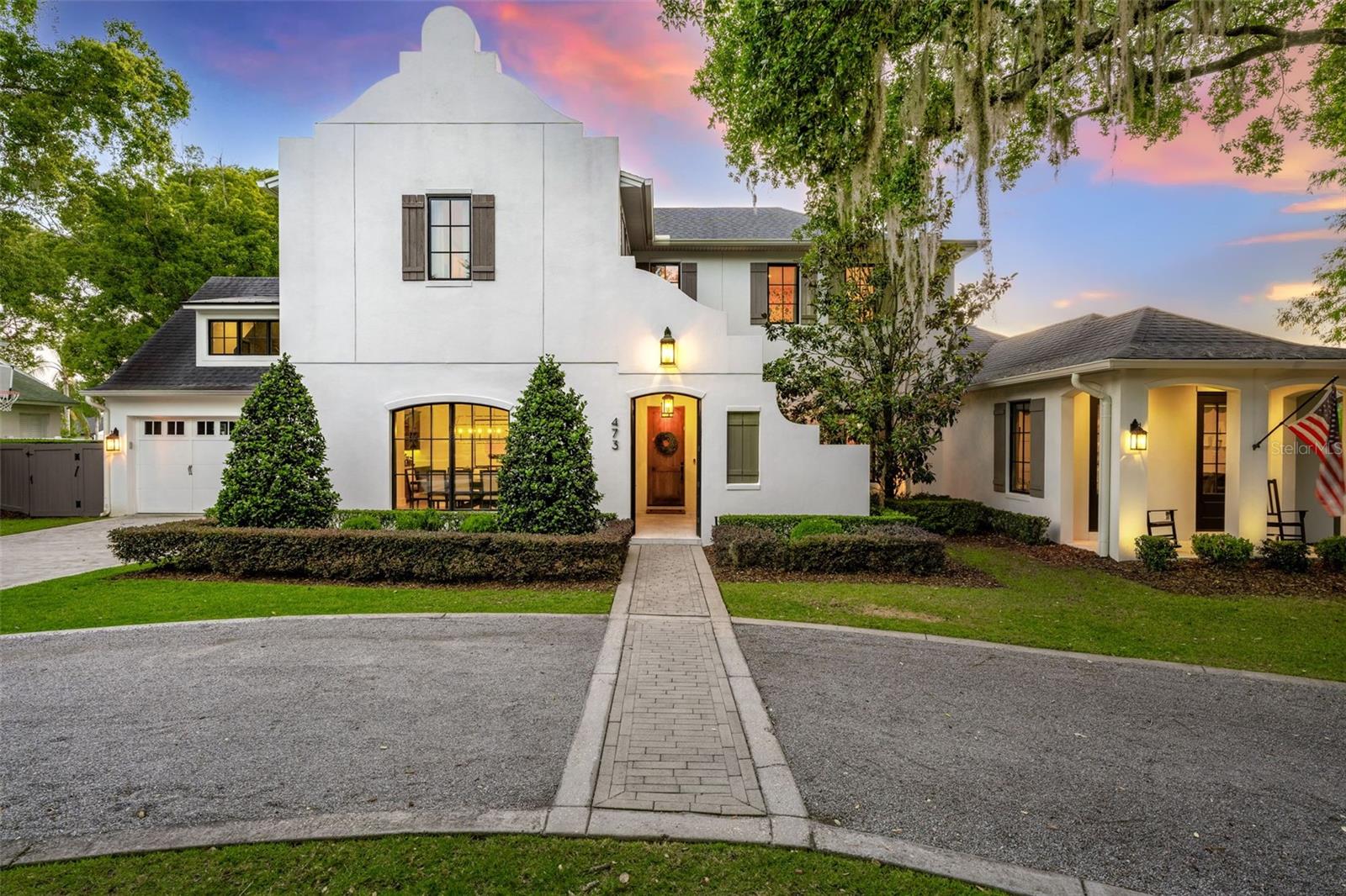 Welcome to the best of Winter Park living, where luxury meets lifestyle and every day feels like a getaway. This stunning custom home, built by Lundev, sits on a quiet, tree-lined street just a mile from Park Avenue and only steps from beautiful Lake Osceola. Imagine walking to brunch on Park Ave, then coming home to launch your paddleboard from the end of your street.

From the moment you pull up, the home makes an impression from its striking architecture to the curved driveway that feels both elegant and inviting. Inside, it’s designed for the way people actually live and entertain today. The chef’s kitchen is the heart of the home, featuring a massive marble island, sleek custom cabinetry, and high-end appliances, all opening up to light-filled living spaces and three sets of French doors that flow seamlessly to the outdoors.

Step outside and you’ll find your own private resort: a heated pool and spa, full summer kitchen, and a cozy cabana with a gas fireplace, all enclosed by automatic screens so you can enjoy the space year-round. Whether it’s a casual family dinner or a lively evening with friends, this backyard is one of the best in Winter Park.

The first-floor primary suite feels like a spa retreat, with a soaking tub and peaceful views of the pool. Upstairs, each bedroom has its own en-suite bath, plus there’s a versatile bonus room and a large home gym that could easily flex into whatever you need, playroom, office, media space, or studio.

Every detail was thoughtfully designed and beautifully executed, but what makes this home truly special is how it feels. Sophisticated yet comfortable. Private yet connected to everything that makes Winter Park so desirable. Just steps from Lake Osceola and moments from the charm of Park Avenue, this home offers a lifestyle that’s as effortless as it is exceptional.