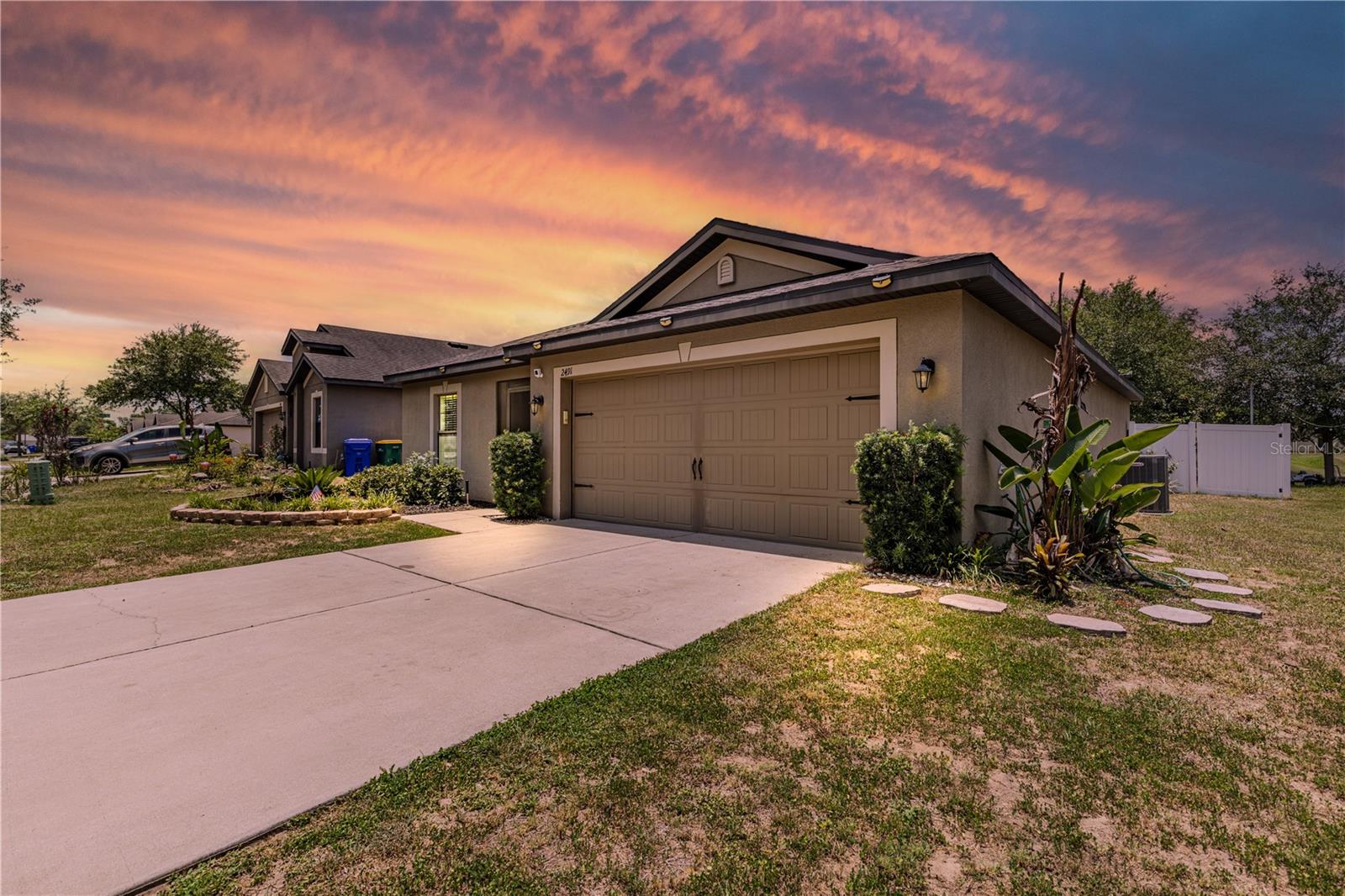 Welcome Home to 2491 Bracknell Forest Trail, a 3-bedroom, 2-bath home located in the desirable Chelsea Oak South community in beautiful Tavares. Situated on a quiet street directly across from the community playground and mailboxes, this property offers the perfect combination of comfort, privacy, and thoughtful design. Throughout the home you will find Luxury Vinyl Plank flooring that adds warmth and durability to every room.The heart of the home is the large kitchen and living room combo, designed with entertaining in mind. The kitchen features a center island with an eat-at island, a closet pantry for additional storage, and has been beautifully upgraded with quartz countertops and butcher block, offering a sleek, modern aesthetic that elevates the entire space. Whether hosting a dinner party or enjoying a quiet morning, this kitchen delivers.This home offers a split bedroom floor plan. The spacious primary suite offers an en-suite bath that has been updated with quartz countertops, complementing the walk-in closet and modern walk-in shower enclosed by glass doors for a spa-like feel. Bedroom two features a ceiling fan and built-in closet, while bedroom three offers a newer light fixture and built-in closet. Whether you need a comfortable guest room, a private home office, or a quiet den, these rooms adapt beautifully to fit your lifestyle. The inside laundry room offers easy access directly into the garage, adding everyday convenience to an already well-appointed home. Step outside and enjoy your fenced in backyard with you covered back porch and enjoy your morning coffee or evening wine. A large patio provides the perfect setting for outdoor furniture and gatherings, while the storage shed adds additional storage space. The vinyl privacy fence allows you to enjoy your outdoor space freely, day or evening while letting your furry friends run freely. Located just minutes from Downtown Tavares or Mount Dora and close to shopping, restaurants, and medical facilities. Do not miss the opportunity to call this HOME! All information recorded in the MLS is intended to be accurate however, it should be independently verified by buyer and their agent. Some photos have been virtually staged. Check out the Virtual Tour!
