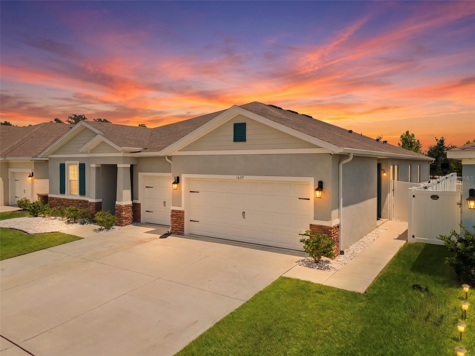 Welcome to this stunning 2021-built home nestled in the Kindred community of Kissimmee, where modern design meets effortless comfort. Boasting FOUR bedrooms, THREE bathrooms, a versatile bonus room, and a THREE-CAR garage, this home also offers 2,851 square feet of open-concept living—everything you need and more! As soon as you step inside, you'll be greeted by a bright, open floor plan with tall tray ceilings designed for both everyday living and entertaining. The kitchen is a true showstopper, featuring a beautifully tiled backsplash and an OVERSIZED ISLAND that flows seamlessly into the living and dining areas, all accented by elegant tray chair railing that carries throughout the home. Tucked privately off the main living space, the IN-LAW suite offers the perfect retreat for guests or extended family. This home has been meticulously maintained, freshly painted, and updated with modern light fixtures throughout, making it completely move-in ready. Step outside and enjoy resort-style living with a fully landscaped front, and back yard, equipped with French drains. Just steps from your SCREENED-IN PATIO, the community clubhouse, pool, and amenities await. Location is ideal, with easy access to major highways, popular shopping, dining, and The Orlando International Airport. Outdoor lovers will appreciate being close to Lake Tohopekaliga, where you can fish, boat, or hike scenic trails along the water. As an added bonus, buyers receive a 1% LENDER CREDIT when using the seller's preferred lender! Schedule a showing today before it's gone!