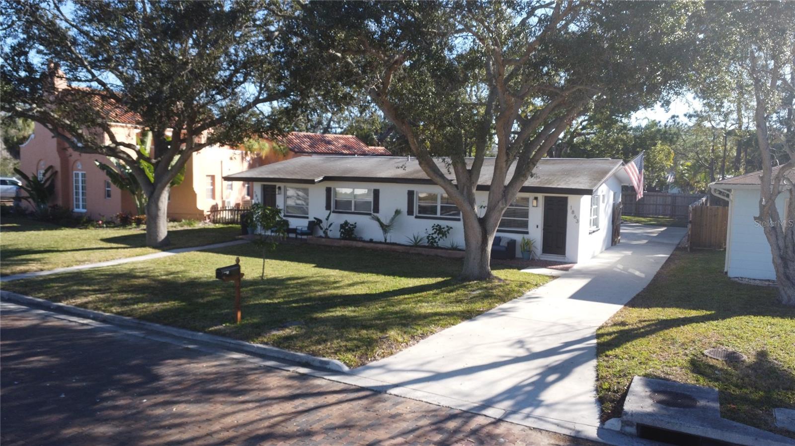 Rare opportunity to own a fully renovated duplex in one of Dunedin’s most desirable coastal locations. This property features two beautifully updated 2-bedroom, 1-bath units (4 bedrooms, 2 baths total), offering exceptional flexibility for owner-occupancy, functional living, or investment in a high-demand rental market. Ideally situated directly on the Pinellas Trail, backing up to Hammock Park, approximately one mile from the Dunedin Causeway, and just 1.5 miles from Downtown Dunedin, the location provides a rare combination of outdoor recreation, coastal access, and over all charm. The home has been completely remodeled inside and out with thoughtful, custom finishes throughout. Both units feature new tile flooring, modern open-concept living areas, and fully remodeled kitchens showcasing butcher block countertops, new cabinetry, subway tile backsplashes, and stainless steel appliances. The kitchens flow seamlessly into the living spaces, creating bright, functional layouts ideal for everyday living or rental appeal. Each bathroom has been fully renovated with custom tile showers, new vanities, and modern fixtures, offering a clean, contemporary aesthetic. Separate laundry rooms for each unit add convenience and privacy. Additional highlights include: • Rear carport with covered parking for two vehicles • Dedicated storage areas for each unit • New oversized concrete driveway • New privacy fencing providing full enclosure • Freshly painted exterior • Updated lush landscaping • Ceiling fans, modern lighting, and consistent finishes throughout. The property has a strong rental history and is currently owner-occupied, allowing flexibility for immediate occupancy or future leasing. With its turn-key condition, exceptional location, and modern upgrades, this duplex gives outstanding long-term value in one of Dunedin’s most sought-after neighborhoods. A truly unique opportunity to own a renovated, coastal duplex with lifestyle appeal, income potential, or both.