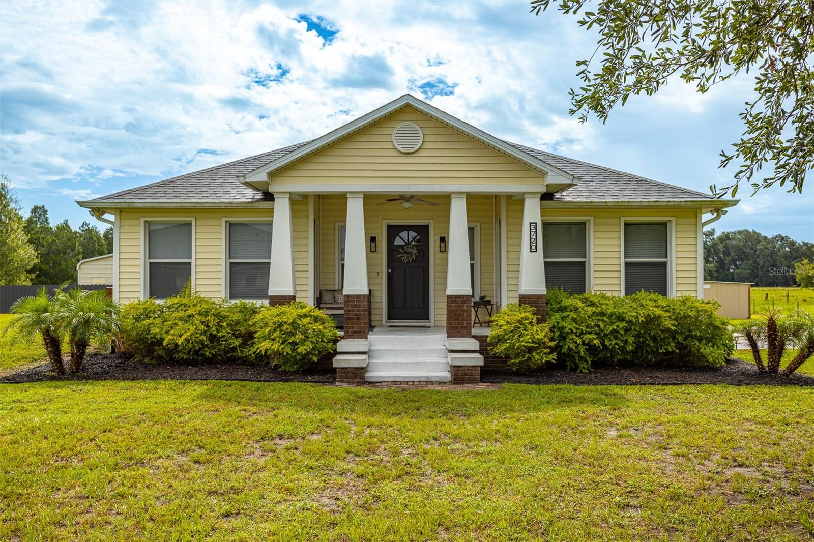A rare opportunity to own your own private retreat on 1.13 picturesque acres with over $50,000 in recent improvements. This beautifully maintained 3-bedroom, 2-bathroom home seamlessly blends modern updates with the tranquility of country living, offering a lifestyle that's increasingly hard to find. Major systems include a 2019 roof, water heater 2023, and 2023 AC, giving the next owner peace of mind from day one.
Inside, you'll appreciate the bright, inviting white paint, updated vinyl plank flooring throughout, refreshed cabinetry, stylish lighting and ceiling fans, a reverse osmosis water filtration system, professionally sealed HVAC ductwork for improved efficiency, and numerous thoughtful upgrades designed for everyday living.
Step outside and discover an outdoor setting designed for both relaxation and entertaining. A spacious 19.5' x 36' covered patio, beautifully landscaped grounds with new palms and hedges, modern exterior lighting, irrigation, a generous parking pad, and extensive concrete improvements create the perfect backdrop for everything from quiet mornings to weekend gatherings. The expansive pole barn 26’ x 55 has been transformed into the ultimate entertaining space with electricity, running water, a generator hookup, outdoor fans, TV setup, and ample room for dining, grilling, and making memories with family and friends.
The impressive 20' x 30' insulated workshop offers endless possibilities. Complete with closed-cell foam insulation, electricity, its own electrical panel, a 24,000 BTU Senville AURA mini-split system, tinted windows, and a ceiling fan, the climate-controlled space is currently enjoyed as a home fitness studio but could easily become a workshop, creative studio, home business, office, or additional recreational space.
If you've been dreaming of a home where nature is part of your everyday life, this is it. Wake up to peaceful views with approximately 20 acres of open grazing land and tree farm behind the property, where neighboring cows and donkeys add to the charming rural setting. Spend your evenings watching sandhill cranes, egrets, geese, and owls that frequently visit the property while enjoying the quiet sounds of the countryside. The irrigation line already extends along the new fence line, making it easy to personalize the landscaping and create your own outdoor oasis.
Additional storage and functionality can be found in the 10' x 10' x 8' water shed, complete with shelving, electrical outlets, lighting, and housing the property's water treatment system. With no HOA and no CDD fees, you have the freedom to bring your boat, RV, toys, and outdoor equipment. Located on a private gated road, this property provides the perfect balance of privacy, security, and flexibility.
Outdoor enthusiasts will appreciate being 10 minutes from Lake Thonotosassa, offering opportunities for fishing, boating, and enjoying the water, as well as nearby McIntosh Nature Preserve with scenic trails and abundant wildlife.
With its extensive upgrades, versatile outbuildings, peaceful acreage, and unbeatable location, this one-of-a-kind property offers a rare opportunity to enjoy the best of Florida country living. This exceptional property is more than a home—it's a place to slow down and enjoy life. Schedule your showing today-this property will go fast!
