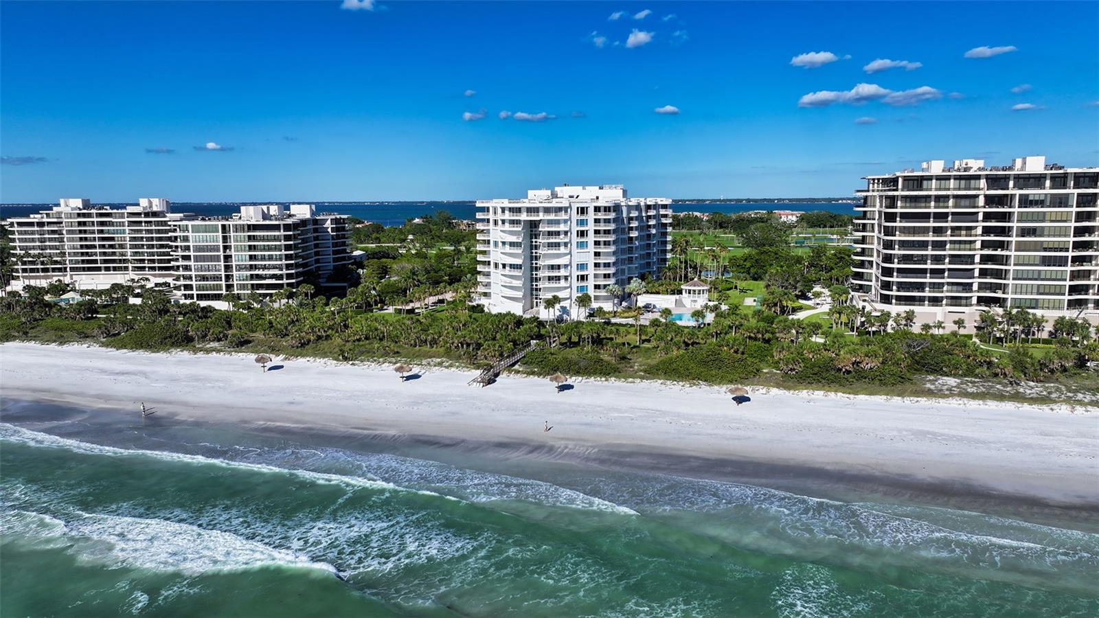 Delight in the pinnacle of luxury living at The Pierre on Longboat Key, where this remarkable 10th-floor penthouse redefines elegance. With 4BR/4.5BA, and a possible 5th BR, this expansive floor plan offers an unparalleled level of space and sophistication. From every room, you can marvel at the panoramic vistas of the Gulf, sunsets, sunrises, bay, Siesta Key and downtown. Be greeted by a bright skylight foyer and soaring 17’ ceilings with clerestory windows in the main living area that creates a sense of openness and grandeur, highlighting the remarkable flexibility of the floor plan. The main suite is a true sanctuary, offering a large office (or extra bedroom), his and her baths, two separate walk-in closets and an additional full bathroom. The Gulf-front "guest wing" can accommodate guests or family, with a spacious guest room with an en-suite bath, dual closets and sliders opening to a terrace overlooking the beach and Gulf. Additionally, it features an oversized family room, which can serve as a potential 3rd guest bedroom, with sliders leading to a terrace with stunning views. The space also includes a beautifully designed office with a view of the Gulf and a 4th BR with a private entrance. The kitchen is exquisitely equipped, with a built-in desk and high-end stainless appliances, plus an adjacent breakfast room with views of the Gulf and access to the terrace. Totaling 1,100 SF, the 3 open terraces allow you to immerse yourself in the natural beauty that stretches in every direction. Additional features include a large utility room with a sink, 2 of the most desirably located side-by-side parking spaces and extra storage cage. Enjoy the added benefit of low price per-square-foot condominium fees for this largest residence as compared to all others in the building. The Pierre is a pet-friendly community offering a host of resort-style amenities, including 3 overflow guest suites, fitness center, tennis courts and Gulf-front heated pool & spa. Golf membership is available through the Longboat Key Club. Room Feature: Linen Closet In Bath (Primary Bedroom).