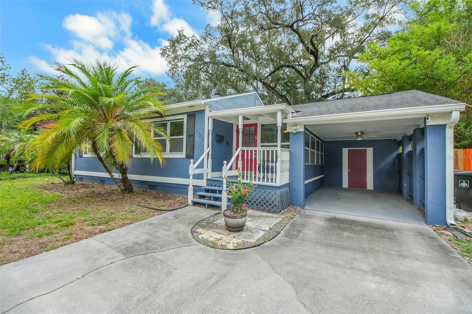 Virtually Staged. Just minutes from Orlando's vibrant MILK DISTRICT,  this charming cottage offers the perfect blend of neighborhood character and urban convenience. Spend your weekends exploring locally owned coffee shops, award-winning restaurants, craft breweries, live music venues, colorful murals, food truck gatherings, and community festivals, then come home to your own peaceful retreat beneath a canopy of mature oak trees. Take the pup for a stroll to nearby Langford Park or enjoy easy access to Downtown Orlando, Lake Eola, Thornton Park, Baldwin Park, and SR-408, making commuting throughout Central Florida quick and convenient. This light-filled 2-bedroom, 1-bath home beautifully combines VINTAGE CHARM with thoughtful modern updates. Ceramic tile flooring runs throughout, while the UPDATED kitchen features granite countertops, 42-inch white soft-close cabinetry, and plenty of workspace. The bathroom showcases its original vintage wall tile, adding authentic mid-century character, while both bedrooms feature original  built-in closets and storage that provide timeless charm rarely found in today's homes. The oversized screened porch creates the perfect outdoor living space for entertaining, relaxing with your morning coffee, or enjoying Florida evenings beneath the shade of majestic oak trees. The fully fenced backyard offers privacy, room to garden or play, and excellent potential for an accessory dwelling unit (ADU) under current City of Orlando regulations. Major updates provide peace of mind, including a roof and HVAC system replaced in 2019, replacement windows, a new water heater, and a transferable termite bond. With no HOA, you'll enjoy the freedom to truly make this property your own. Whether you're looking for your first home, a charming primary residence, or an investment opportunity in one of Orlando's most sought-after neighborhoods, this cottage delivers timeless character, modern conveniences, and an exceptional location. Rare oversized lot in the heart of the Milk District with exciting ADU potential (subject to City approval), offering future opportunities for multigenerational living, guest accommodations, or rental income.