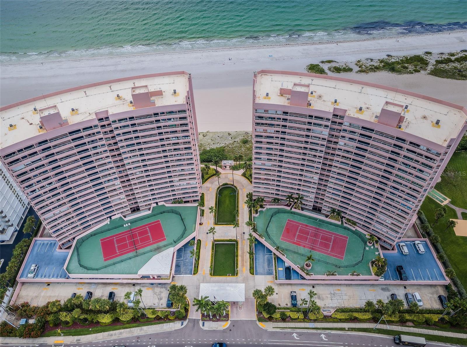 Presenting a rare opportunity to own the Crescent Beach Club II Luxury Sky Penthouse "A". The Ultimate crown jewel of Sand Key Beach with Gulf front grandeur featuring the panorama of the gulf and intracoastal regatta views from five balconies! Wow factor terraces from every room featuring sweeping aquamarine seascapes and balmy beach breezes, this coveted corner residence has breath taking views of the morning sunrises, tranquil sunsets and exciting Clearwater downtown. Terraces ideal for the avid sun worshipper with spectacular outdoor living and entertaining. Residence offers a fusion of French décor and Italian-inspired design of grand living space with modern crystal cascade chandelier, polished travertine floors, fireplace, spacious open floor plan with an abundance of natural light and water views from every room! Cucina features Frigidaire Professional Stainless Collection, dual ovens, custom cabinetry, bar height peninsula and more! Dining area with wet bar, scenic surround sweeping ebb and flow of Gulf Waters. Master suite features terrace access and bath retreat jetted tub, walk in shower and spectacular picture window Gulf views!  Hurricane Shutters for year-round protection. Enjoy direct access to the beach, heated oceanfront pool and spa, 4 BBQ grills, 2 sets of tennis/pickleball courts, indoor hot tub overlooking the beach, fitness center, and a billiards room. Crescent Beach Club offers resort-style living within a gated complex, 24-hour security, on-site management, and private level owners parking. Enjoy the convenience of walking to nearby restaurants, shops and boutiques.