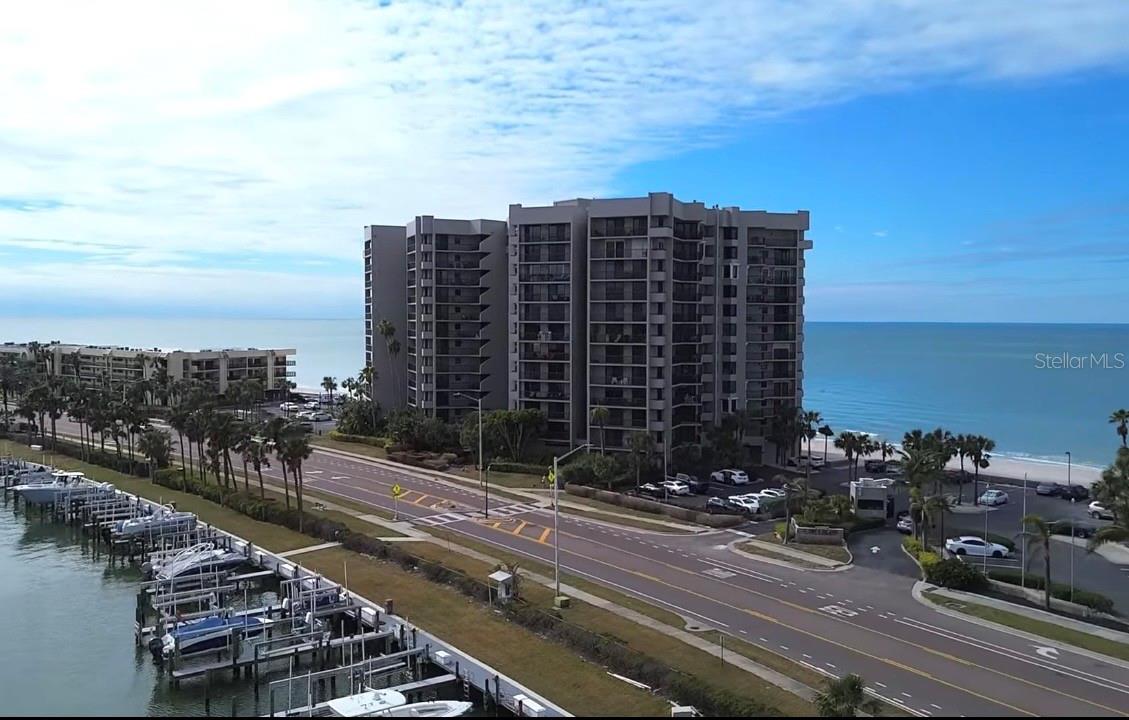 LUXURIOUS BEACHFRONT PENTHOUSE - UNMATCHED GULF VIEWS. 
Enjoy elevated coastal living in this exceptional 12th-floor penthouse, one of only two true penthouses on the floor, featuring dual primary suites and unobstructed panoramic views of the Gulf and Intracoastal Waterway. Step outside your building and you are directly on the sand-a rare and coveted beachfront lifestyle with 24/7 gated entry and staffed security guards. Spanning 3,532 square feet, this renovated 4-Bed, 4-Full Bath residence delivers ultimate comfort and flexibility for both owners and guests. An open-concept floor plan deigned for effortless entertaining is complemented by floor-to-ceiling windows and two expansive wraparound decks, creating a seamless indoor-outdoor experience with breathtaking sunsets and endless water views. The designer kitchen is a true showpiece, highlighted by illuminated Crystallo Quartzite Countertops, premium appliances, and custom finishes throughout. Elegant details such as artwork lighting and two electric fireplaces add warmth and sophistication to the space. Additional Highlights include: Dual primary suites, Exceptional closet space throughout, Rare 240sq ft private storage room in the garage plus an additional double storage unit on the Penthouse level, Two wraparound terraces for spectacular views, Under-building garage parking (premium space valued at approximately $100,000) located within steps to the lobby. Minutes to Clearwater Beach. Residents enjoy resort-style amenities including a heated beachfront pool and spa, basketball/racqetball court, and a large clubhouse with complete kitchen, big screen tv and pool table that is ideal for meetings, entertaining and private events. This is a rare opportunity to own a premier penthouse in one of Florida's most sought-after beachfront locations-where luxury, privacy, and breathtaking views come together.