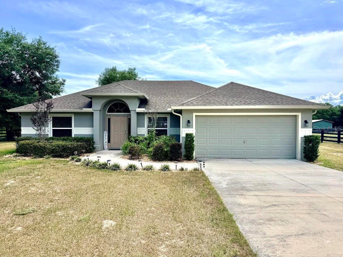 Welcome home to a rare slice of Florida paradise - where acreage, a private lake, and room to breathe await. Nestled in the heart of charming Umatilla, this 4-bedroom, 2-bath property provides the perfect blend of country serenity and everyday comfort, whether you're raising a family or finally slowing down to enjoy the good life. From the moment you turn down your long, private driveway, you'll feel the pace of the world shift. This is a place that rewards you for staying home. Step outside and the lifestyle speaks for itself. Spend your evenings watching fiery Florida sunsets paint the sky over your sprawling 16×35 pool and shimmering lakefront - a view that never gets old. The spacious patio is made for morning coffee, family cookouts, and lazy afternoons with nothing on the agenda. For those with a love of the land, this property delivers in spades. A thriving chicken area and dedicated garden area produce over a dozen fresh eggs daily - your own farm-to-table life without the farm work of a full homestead. The impressive 24×36 barn provides endless possibilities: store equipment, create the workshop, studio, or hobby space you've always envisioned. A backyard zip line, tire swing, playset, and more, brings endless adventure, while the private lakefront is great for kayaking, fishing, or simply skipping stones on a quiet afternoon. All of this sits in the warm, welcoming community of Umatilla - a small town with a big heart, known for its friendly neighbors, local character, and easy access to the natural wonders of Lake County. You're close enough to everything, yet far enough away that it truly feels like your own world. Opportunities like this are rare, especially in this area of Umatilla. Private, peaceful, and packed with lifestyle - this is the one you've been waiting for. Don't miss out, this one won't last long.
