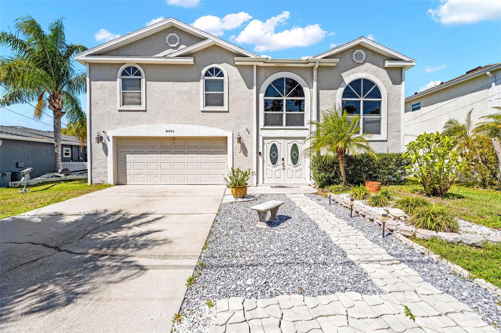 DIRECT GULF ACCESS, NO FIXED BRIDGES, 10,000 LB BOAT LIFT, ASSUMABLE VA MORTGAGE, AND STUNNING SUNSET VIEWS! 

Welcome to this exceptional waterfront home in one of Port Richey's most desirable boating communities. Built in 2003 and perfectly positioned on a deep-water canal with DIRECT ACCESS TO THE GULF, this move-in-ready property offers the ultimate Florida waterfront lifestyle with the ability to boat, fish, kayak, or cruise to waterfront restaurants right from your backyard.
Designed for both comfort and entertaining, this spacious two-story home features an OPEN-CONCEPT FLOOR PLAN filled with natural light and beautiful water views throughout. The kitchen is equipped with GRANITE COUNTERTOPS and flows seamlessly into the main living areas, while UPDATED BAMBOO FLOORING adds warmth and character throughout the home.
The primary suite serves as a private retreat, featuring its own waterfront lanai, two closets including a large WALK-IN CLOSET, and peaceful views of the backyard and canal. Whether enjoying your morning coffee or winding down after a day on the water, this space was designed to embrace the coastal lifestyle.
Boaters will appreciate the STATIONARY DOCK WITH WATER AND ELECTRIC, FLOATING DOCK, and 10,000 LB BOAT LIFT, providing quick and convenient access to the Gulf with NO FIXED BRIDGES. The west-facing backyard offers breathtaking Florida sunsets and is fully fenced, making it perfect for pets, gatherings, and outdoor enjoyment.
Step outside onto the OVERSIZED COMPOSITE WATERFRONT DECK, recently upgraded for years of low-maintenance enjoyment. Complete with a TIKI BAR featuring electric and running water, this outdoor space is ideal for entertaining family and friends while enjoying panoramic water views and unforgettable sunsets.
Major improvements include a NEW ROOF (2024) and NEW HVAC SYSTEM (2025), providing peace of mind for years to come. Additional features include a HUGE 21' x 30' GARAGE, a SEPARATE STORAGE GARAGE, and ample space for all your boating, fishing, and outdoor equipment.
An added bonus is the ASSUMABLE VA MORTGAGE with an approximate balance of $150,000 at just 2.75% interest (subject to lender approval), offering a unique financing opportunity for qualified buyers. The current flood insurance policy through Progressive is approximately 722 annually.
Conveniently located near US-19, shopping, dining, marinas, parks, and local entertainment, this home offers the perfect balance of waterfront privacy and everyday convenience. The seller has already moved out, making this home VACANT, MOVE-IN READY, and waiting for its new owner. If you've been searching for a true Gulf-access property with modern updates, exceptional outdoor living, and direct boating access, this is the one you've been waiting for. Schedule your private showing today and experience Florida waterfront living at its finest.