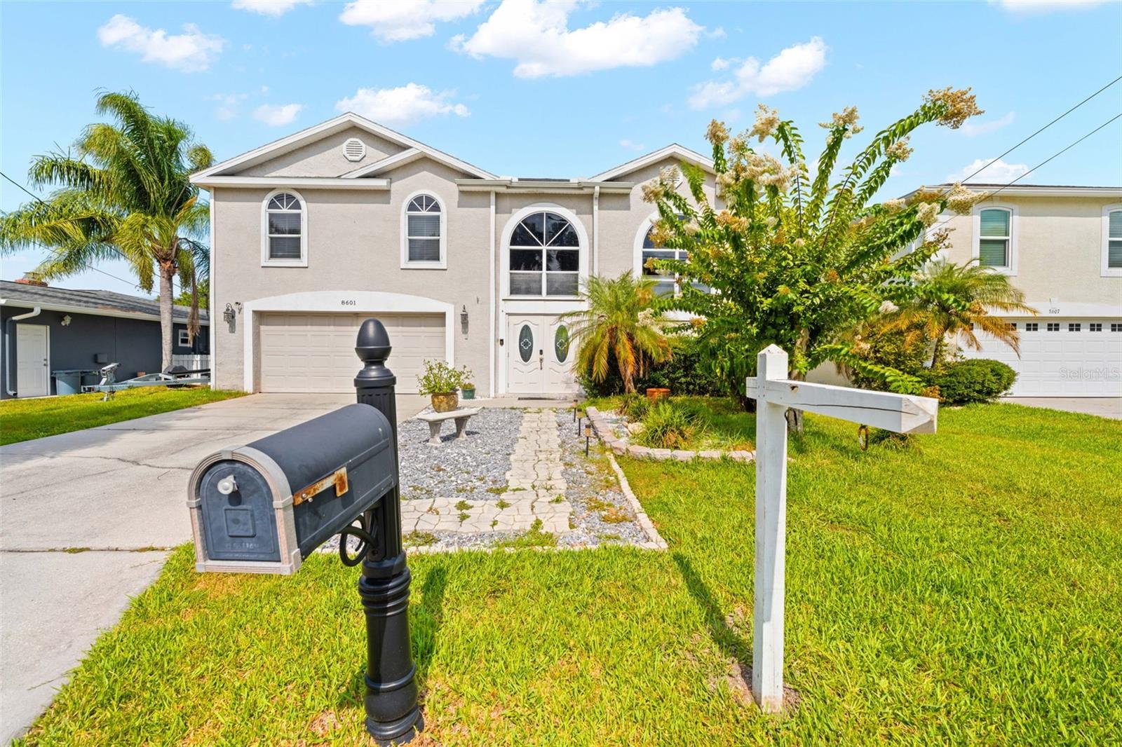 DIRECT GULF ACCESS, NO FIXED BRIDGES, 10,000 LB BOAT LIFT, ASSUMABLE VA MORTGAGE, AND STUNNING SUNSET VIEWS! 

Welcome to this exceptional waterfront home in one of Port Richey's most desirable boating communities. Built in 2003 and perfectly positioned on a deep-water canal with DIRECT ACCESS TO THE GULF, this move-in-ready property offers the ultimate Florida waterfront lifestyle with the ability to boat, fish, kayak, or cruise to waterfront restaurants right from your backyard.
Designed for both comfort and entertaining, this spacious two-story home features an OPEN-CONCEPT FLOOR PLAN filled with natural light and beautiful water views throughout. The kitchen is equipped with GRANITE COUNTERTOPS and flows seamlessly into the main living areas, while UPDATED BAMBOO FLOORING adds warmth and character throughout the home.
The primary suite serves as a private retreat, featuring its own waterfront lanai, two closets including a large WALK-IN CLOSET, and peaceful views of the backyard and canal. Whether enjoying your morning coffee or winding down after a day on the water, this space was designed to embrace the coastal lifestyle.
Boaters will appreciate the STATIONARY DOCK WITH WATER AND ELECTRIC, FLOATING DOCK, and 10,000 LB BOAT LIFT, providing quick and convenient access to the Gulf with NO FIXED BRIDGES. The west-facing backyard offers breathtaking Florida sunsets and is fully fenced, making it perfect for pets, gatherings, and outdoor enjoyment.
Step outside onto the OVERSIZED COMPOSITE WATERFRONT DECK, recently upgraded for years of low-maintenance enjoyment. Complete with a TIKI BAR featuring electric and running water, this outdoor space is ideal for entertaining family and friends while enjoying panoramic water views and unforgettable sunsets.
Major improvements include a NEW ROOF (2024) and NEW HVAC SYSTEM (2025), providing peace of mind for years to come. Additional features include a HUGE 21' x 30' GARAGE, a SEPARATE STORAGE GARAGE, and ample space for all your boating, fishing, and outdoor equipment.
An added bonus is the ASSUMABLE VA MORTGAGE with an approximate balance of $150,000 at just 2.75% interest (subject to lender approval), offering a unique financing opportunity for qualified buyers. The current flood insurance policy through Progressive is approximately 722 annually.
Conveniently located near US-19, shopping, dining, marinas, parks, and local entertainment, this home offers the perfect balance of waterfront privacy and everyday convenience. The seller has already moved out, making this home VACANT, MOVE-IN READY, and waiting for its new owner. If you've been searching for a true Gulf-access property with modern updates, exceptional outdoor living, and direct boating access, this is the one you've been waiting for. Schedule your private showing today and experience Florida waterfront living at its finest.