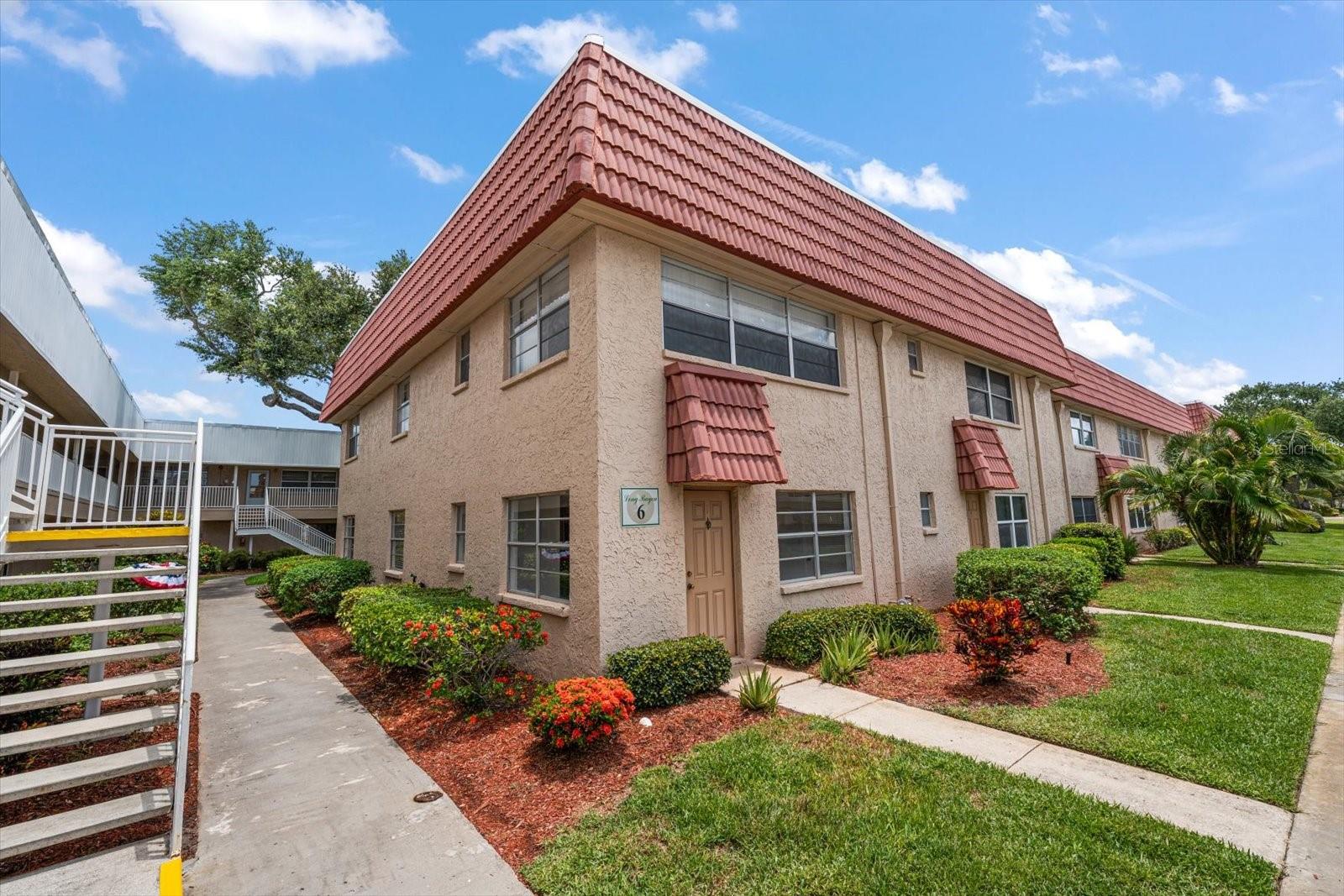 Discover main-level living in this spacious 2-bedroom, 2-bath condo, ideally situated in a prestigious 55+ gated community just a short drive from Madeira Beach.   Residents enjoy access to exceptional amenities that include a beautiful waterfront pool and spa, recreation room, auditorium, fitness room, billiard room, card rooms, workshop, arts and crafts room, library, tennis courts, pickleball, shuffleboard and bocce ball. Conveniently located to shopping, restaurants, movie theater and more! This property invites you to experience comfort and community at its finest. Schedule your viewing today to explore the potential of making this your new home.