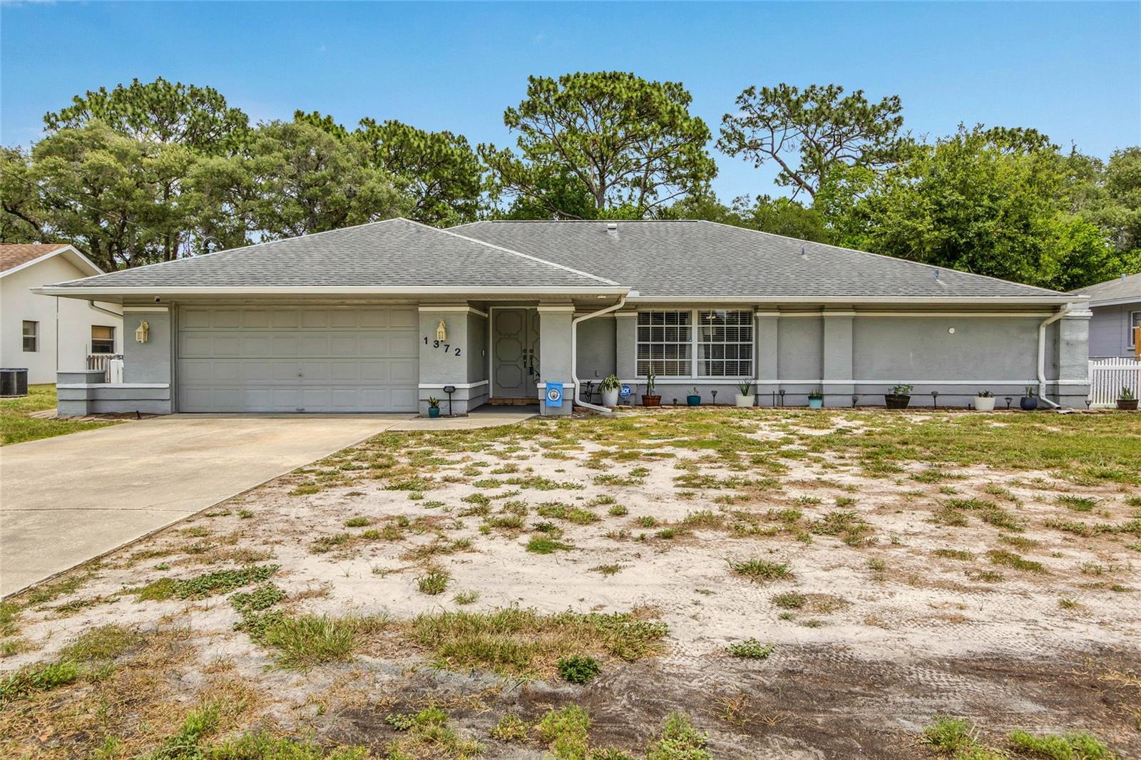 Welcome to this well-maintained Spring Hill pool home offering flexible living space, thoughtful updates, and the Florida lifestyle buyers are searching for. Available furnished or unfurnished, this property provides an excellent opportunity for a full-time residence, seasonal home, or investment property. This spacious home features 2 bedrooms, 2 full bathrooms, a 2-car garage, and an additional room with a closet under air. While the flex room does not have the required egress to be considered an official bedroom, it offers excellent flexibility as a guest room, home office, hobby room, or additional living space. The inviting floor plan includes formal living and dining areas, a dual-door entry, and a comfortable layout designed for both everyday living and entertaining. The kitchen features updated appliances, a dining nook, pantry, and ample cabinet space, making it both functional and convenient for daily life. The primary suite offers a walk-in closet, dual vanities, and a tiled walk-in shower with a built-in bench seat. Step outside to your own private backyard retreat. The screened pool area is perfect for relaxing or entertaining, while the fully fenced backyard provides privacy and plenty of space for pets, gardening, or outdoor activities. Important updates include a roof replaced in 2013, HVAC system replaced in 2020, and updated kitchen appliances, providing added value and peace of mind. Conveniently located near shopping, restaurants, medical facilities, parks, and local attractions, this home offers easy access to everything Spring Hill has to offer while remaining just a short drive from the Gulf Coast's boating, fishing, kayaking, and waterfront dining opportunities. Offering a private pool, flexible floor plan, negotiable furnishings, and a convenient location, this home combines comfort, versatility, and Florida living. Schedule your private showing today.