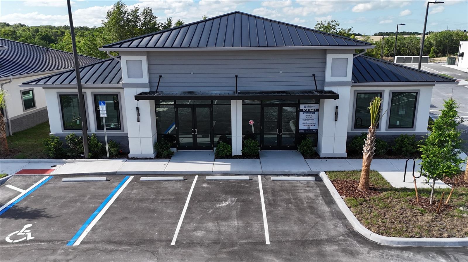 Building #13 is available for purchase at Lake Carter Exchange, a distinguished mixed-use development in Apopka’s East Shore at the intersection of Ocoee-Apopka Road and W Keene Road. This dark gray shell building is ideal for medical or professional offices, with potential for retail use based on buyer needs. The shell delivery offers full flexibility for custom interior design with two front entrances supporting up to two unique suites. The development is strategically located less than one mile from Advent Health’s seven-story, 120-bed hospital and opposite a new Publix Supermarket development. Situated in the vibrant East Shore trade area, which includes 5,000 planned residences and an average household income above $100k, this Class A property is perfectly positioned for businesses targeting growth in Central Florida’s second-fastest-growing city. Contact us for pricing details/incentives and to schedule a tour of this exceptional commercial opportunity.