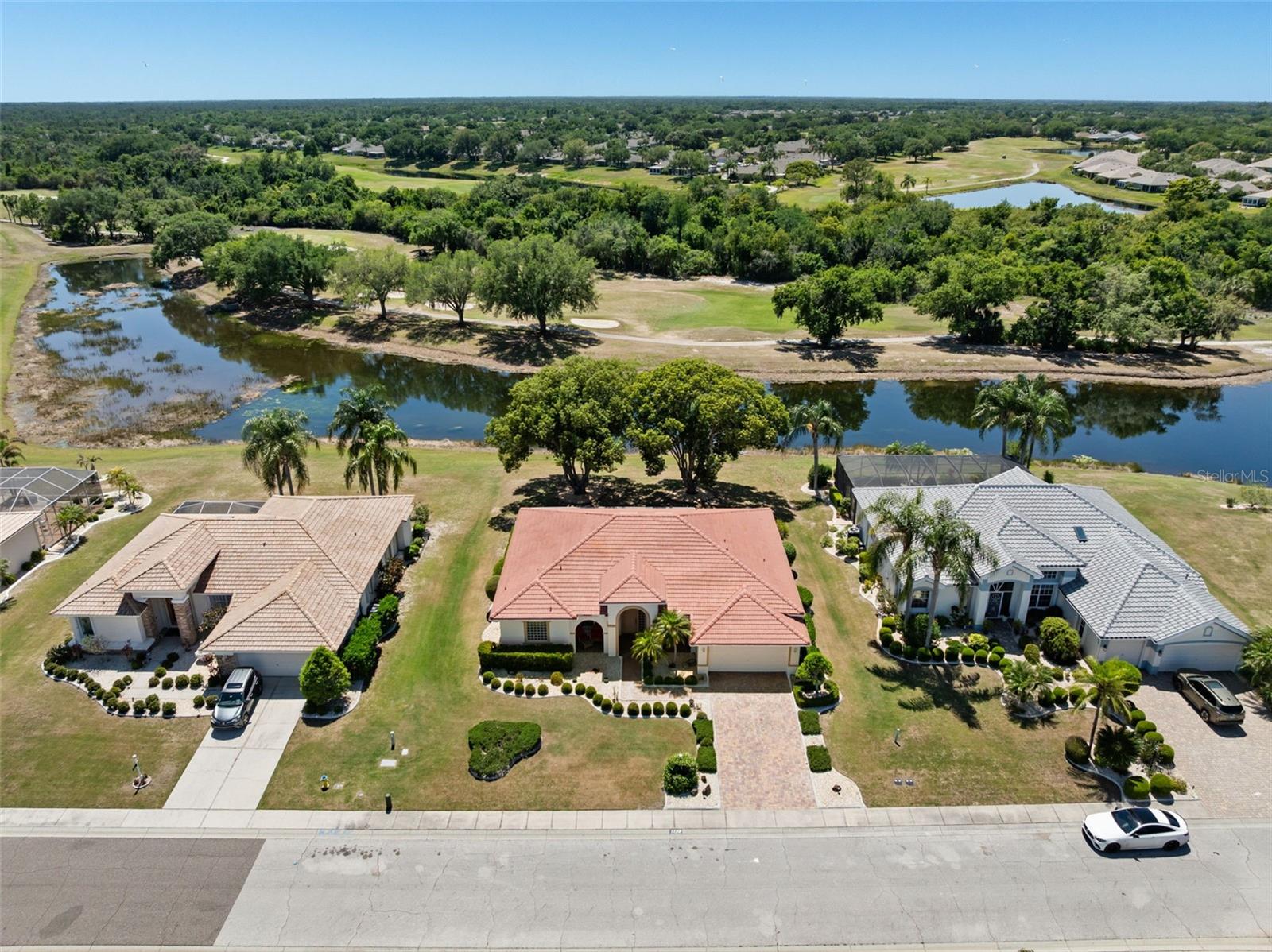 Discover an incredible opportunity located on Signature Drive in the Estates at Lake View in Sun City Center!  This 3-bedroom, 2-bathroom home has just under 2,100 sq. ft., sits on just over a quarter acre with Conservation, Golf Course, and Pond Views!  This is a golf cart friendly community where PETS ARE WELCOME with No Weight Limit! There is No CDD, No Flood Zone, and the grounds maintenance is included in the Low HOA fee. When you enter, you will be greeted by immediate views and space to accommodate oversized furniture with ease.  The kitchen is UPDATED with Granite countertops, stainless steel appliances, closet pantry and a dinette which is perfect for quick meals. Three sets of sliders provide access to the screened and covered lanai where you can enjoy peaceful water views, a variety of wildlife, and views of golfers playing on the Renaissance Golf Course.  The split floor plan places the primary suite at the rear of the home, showcasing stunning views, a double tray ceiling, plantation shutters, and dual walk-in closets. The updated en-suite includes Granite countertops on separated vanities, an oversized walk-in shower, and a private water closet. Two additional bedrooms are generously sized and have convenient access to the updated second full bath with a walk-in shower, Granite countertops, and ample storage. The inside laundry room includes cabinets and shelving for added convenience. This home is being offered with furnishings if desired!  The HVAC system was installed in 2025, and the roof was resealed in 2024.  This is a GOLF CART FRIENDLY community where there are activities to suit every interest! The amenities include community pools (indoor & outdoor), fitness, shuffleboard, softball, pickleball, lapidary, art and more! Most other needs are a golf cart drive away including grocery shopping, salons, banks, Veterans support, and a hospital!  Tampa International Airport is just under 40 minutes away and just 20 minutes to Ellenton Prime Outlets!