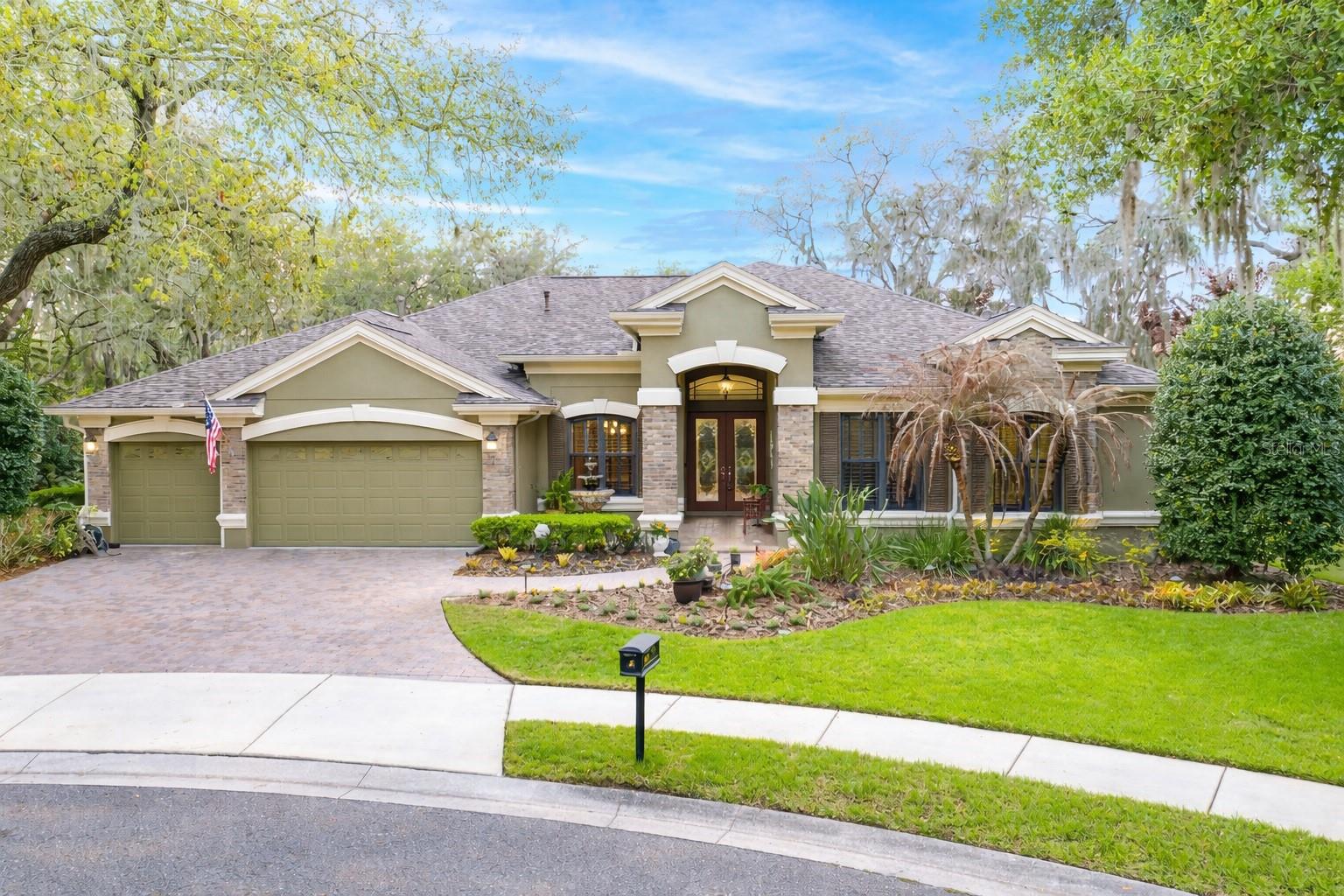 Positioned on one of the most coveted lots in FishHawk Ranch, this stunning home offers the perfect balance of privacy, smart design, and upgraded features—ideal for both everyday living and entertaining. Tucked away on a premium .53-acre pie-shaped cul-de-sac lot with sweeping conservation and pond views, you’ll enjoy a private, tranquil setting with no backyard neighbors—creating a true sense of retreat from the moment you arrive. This home also includes an impressive list of upgrades that add both value and peace of mind, including a new roof (2023) with a transferable 25-year warranty, solar radiation barrier, 8MM window tint, and two AC units replaced within the last four years with UV filters. The pool has been enhanced with new solar panels (2023) and a new salt cell (2022), and additional safety features include an upgraded fire alarm system in the garage and laundry room. Don’t miss the tankless water heater. The outdoor living space is nothing short of spectacular and sets this home apart. Designed to feel like a private resort, the home wraps around a screened lanai with travertine that invites you to relax or entertain with ease. A fully equipped outdoor kitchen, including a bar with built-in fire pit and an extended cabana, creates the ideal setting for hosting and outdoor dining. The solar-heated saltwater pool is a showpiece—custom-designed with two waterfall bowls, a sun shelf, and a spa with a cascading waterfall feature. Surrounded by lush tropical landscaping and vibrant flower gardens, the backyard is both stunning and serene—undeniably the ultimate gathering spot. Inside, nearly 4,000 square feet of living space unfolds with a layout designed for both everyday comfort and entertaining. Pocket sliding doors in both the living and family rooms create a seamless indoor-outdoor connection, flooding the home with natural light and extending the living space effortlessly. At the heart of the home, the kitchen is a true chef’s dream. Open to the family room, this space naturally becomes the hub of the home—designed for gathering, hosting, and everyday moments where conversation flows with ease. You’ll also find abundant storage, upgraded flooring in the bedrooms, bonus room, and office, along with crown molding, cathedral tray ceilings, and coffered accents throughout. The layout offers incredible flexibility, including a private home office and a spacious bonus room to fit your needs. A custom upgraded full bath at the front of the home creates an ideal opportunity for an in-law suite or private guest space. The primary suite is tucked away on its own side of the home, offering maximum privacy and a true retreat-like feel. It features two walk-in closets and an en-suite bath with dual vanities, a soaking tub, and a walk-in shower. Three additional bedrooms are generously sized—two connected by a Jack-and-Jill bath, while the fourth is located near another full bathroom, making it ideal for guests. Did I mention the 3 car garage with super epoxy finish? Located within the gated Tern Wood enclave and zoned for A-rated schools, this home offers the opportunity to enjoy one of Hillsborough County’s most sought-after communities—paired with a truly exceptional property that stands in a class of its own.