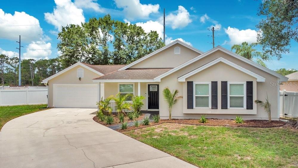 One or more photo(s) has been virtually staged. Welcome to this well maintained and thoughtfully updated 3 bedroom, 2 bathroom home in a highly desirable Orlando location just minutes from UCF, Research Park, Waterford Lakes, shopping, dining, and major highways. Whether you're a first time homebuyer, a growing family, or someone looking for a home with room to make lasting memories, this property offers the perfect combination of comfort, convenience, and value. The home features numerous recent upgrades, including a new HVAC system, insulated hurricane impact windows, sliding glass door, front entry door, and water softening system. The kitchen has been refreshed with updated cabinetry, a stainless steel sink, smart faucet, and a like new dishwasher, while newer appliances, lighting, ceiling fans, and updated bathrooms add to the home's move in ready appeal. Step outside to the screened in patio leading to the EXPANSIVE fenced in backyard, offering endless possibilities for entertaining, gardening, pets, play, or future outdoor living enhancements. With major systems already updated and an unbeatable location near UCF and Orlando's growing innovation corridor, this is a wonderful opportunity to own a home that has been exceptionally cared for and is ready for its next chapter.