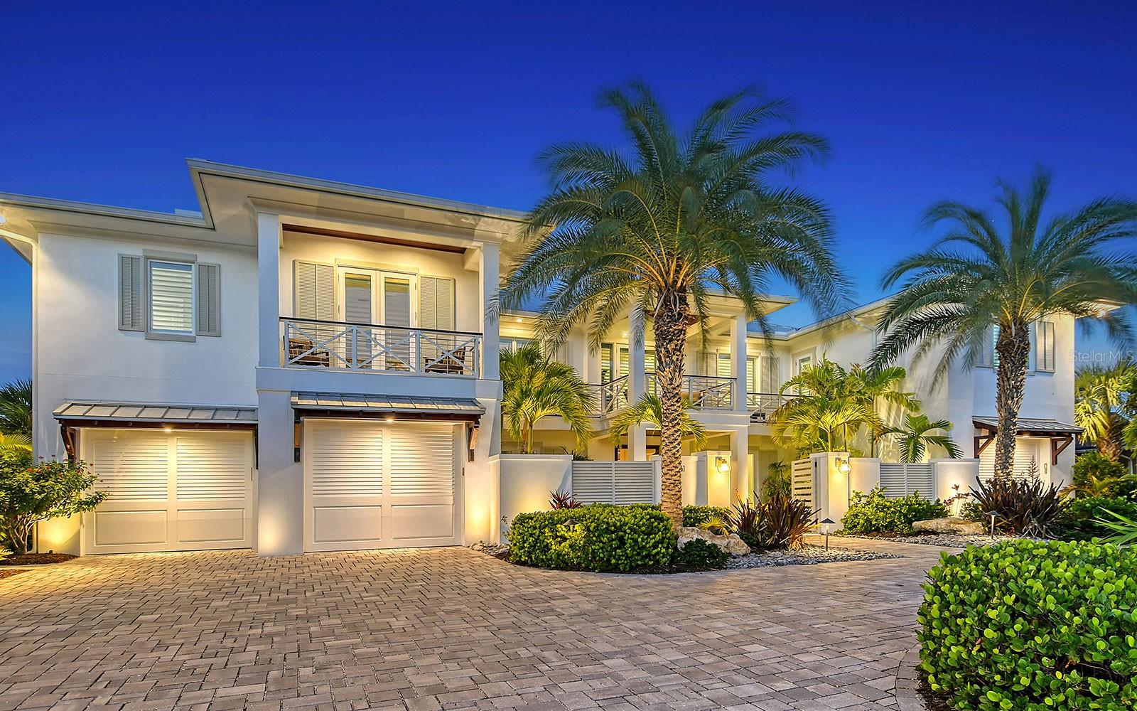 Crystal clear coastal waters and brilliant blue skies converge to create a beautiful backdrop of sweeping views from this Anna Maria Island coastal paradise. 100-ft. on open water with boat dock, two boat lifts, two recreational craft lifts, and direct access to Tampa Bay and the Gulf of Mexico. Walk to Key Royale Club, the only golf course on the island. Ultra private and upscale, Key Royale is highly desired by boaters, anglers, yachtsmen and golfers.This spectacular home has a stunning interior featuring white shiplap cathedral ceiling and wall-to-wall glass for uninterrupted water views. Calming coastal colors complement the seaside setting. The generous 3,388 sq. ft. floor plan includes four bedrooms, four baths, sitting room, flex room, bonus room, gym, and open living area with living room, dining room and kitchen. Luxury features include elevator, high ceilings, hardwood flooring, solid-core doors, solid-wood cabinetry, stone countertops, shiplap plank ceilings, plantation shutters, gas fireplace with massive floor-to-ceiling granite accent wall, Lutron lighting, automated screens, and garage parking for four cars. The immaculate high-end kitchen features Thermador and SubZero appliances, oversize eat-in island and solid-wood cabinetry with honed stone countertops. This waterfront masterpiece opens to an outdoor setting where exceptional living continues -- covered patio with outdoor kitchen, outdoor dining and lounge area; heated pool/spa with infinity edge; sun deck; fire pit; and dock with four lifts. Located on a quiet, dead-end street in Key Royale on north Anna Maria Island, just minutes to white-sand beaches, and quaint shopping and dining.Enjoy all the perks of modern-day living with a strong sense of island hospitality in this coastal paradise on Florida’s Gulf Coast. *Be sure to watch the 3D virtual walkthrough tour and full video.*