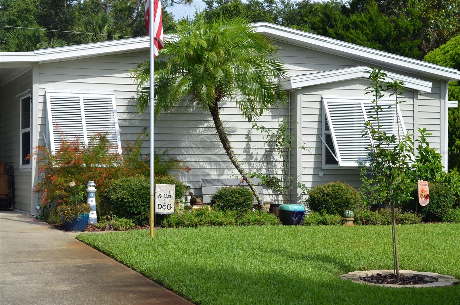 2 Bedrooms 2 bath home with formal living, dining, family room, enclosed air-conditioned Florida room. Roof replaced 03/2017, installation of luxury vinyl plank throughout and tile flooring in bathrooms, removal of polybutylene pipes, installation of side pavers, 39'x12' wood frame garage with 10x7 garage door and 6x7 golf cart magic door with 2 remotes & outdoor keypad.  In 2020 installation of new sprinkler pump 4 zoned sprinkler system, replace home windows with single hung double-paned insulated & screens, storm protection Bahama Shutters overall new windows, installed new A/C 4 ton 16 seer 2 stage heat pump package with UV light Sanitizer, Wi-Fi Controlled Thermostat with a labor plus warranty package effective until 2030. Well-maintained beauty situated on a large pie-shaped lot landscaped with Fruits/Nut trees. You own your own land. Low HOA includes all the amenities such as a fitness Center, ceramics, heated pool, covered hot tub, tennis, pickleball, bocci, shuffleboard, horseshoes, fishing pier, cleaning stations, woodworking, pool tables, quilting and so much more! Resort living every day. DO NOT miss out on this TURNKEY home. ;Water: City