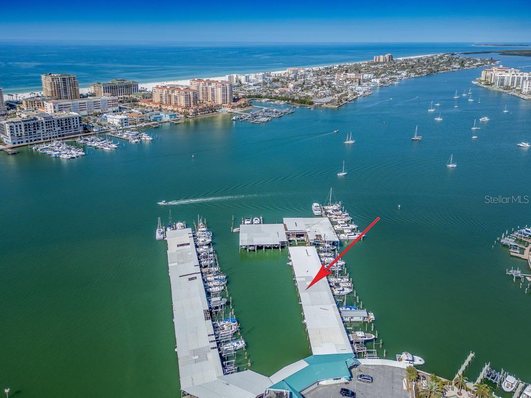 One or more photo(s) has been virtually staged. Purchase the perfect place for your Yacht at the Island Yacht Club Marina located on Island Estates. This is one of few private marinas that allow short term rentals. This is a deep water slip with easy access to the Gulf of America and Intracoastal waterway. THIS IS A COVERED DEEP WATER SLIP, WITH NO LIFT. This marina offers a club room and restrooms with showers. Located on Island Estates, you are a short stroll to dining, shopping ,banks and Publix grocery. The Seller just installed a new Eaton Newport Harbor Mate electric connection. You are a half a mile to our famous Clearwater Beach, and 20 minutes to 2 International air ports. Come live what we locals call "The Salt life"