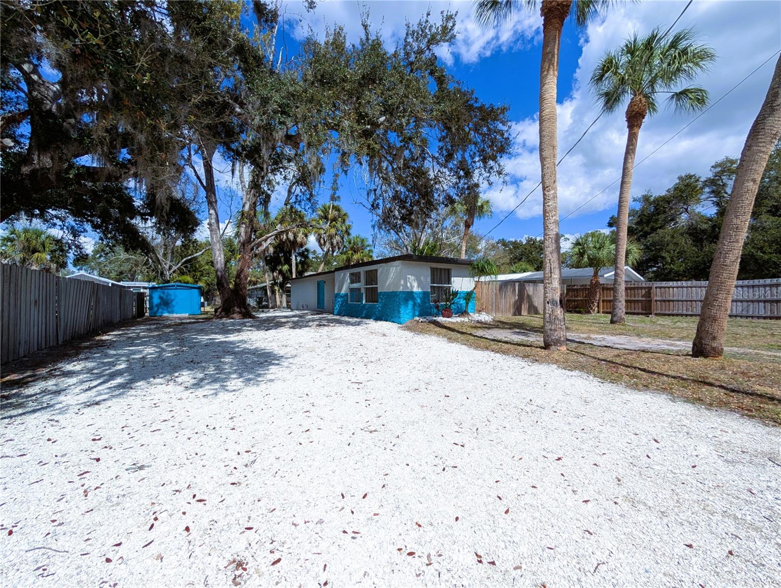 Location, location, location!!! Updated solid block house (including new solid wood kitchen with quartz countertops, open floor plan), large fenced lot, quiet street, one block to a large community park, no HOA/no deed restrictions, no flood zone, boat ramp access to golf waters is within two miles! Easy maintenance, lots of natural light, great as a starter home, vacation home, short/long-term rental, or a cozy retirement destination in a pet-friendly community. Close to shopping, restaurants, downtown waterfront walk and marina, international airport, several miles to Lido Beach, St. Armands Key, Selby Botanical Gardens, museums, iconic Van Wesel Performing Arts Hall, Opera House, Ringling College of Art & Deign (walking distance), New College of Florida (honors), University of South Florida. Two neighboring new construction houses are to be sold for over 500k each. Priced to sell; VA, FHA, and conventional financing is welcome.