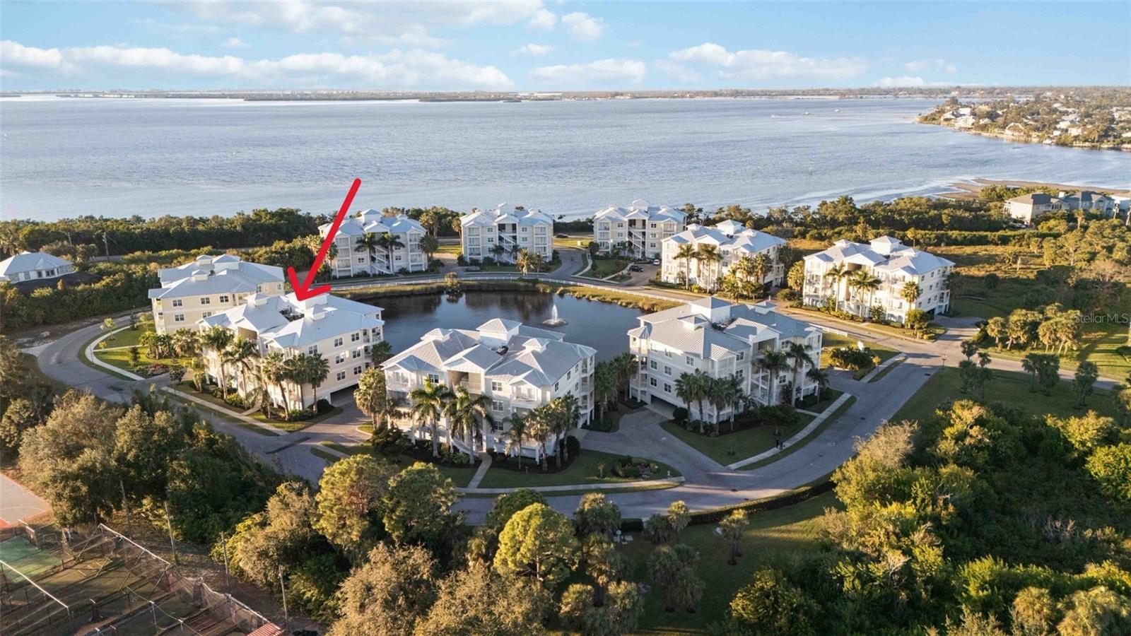 One or more photo(s) has been virtually staged. Price Improvement - Exceptional Value in Palma Sola Bay Club.

Ideally located just 4 miles from the Gulf beaches of Anna Maria Island, this 3-bedroom, 2.5-bath residence offers an outstanding opportunity to enjoy one of West Bradenton's premier gated coastal communities. With 1,854 square feet of living space, impact windows, soaring ceilings, and a bright open floor plan, this home delivers the space and lifestyle buyers are seeking at an attractive new price point.

The kitchen features granite countertops, stainless steel appliances, and a breakfast bar ideal for casual dining and entertaining. The spacious primary suite includes a private balcony, large walk-in closet, and spa-style bath, while two additional bedrooms provide flexibility for guests, a home office, or seasonal visitors.

Set within 30 acres of beautifully maintained grounds, Palma Sola Bay Club offers resort-style amenities including a heated pool, elegant clubhouse, fitness center, billiards lounge, scenic walking paths, tropical landscaping, and three tranquil ponds. Residents enjoy a relaxed coastal lifestyle just minutes from Anna Maria Island, IMG Academy, Palma Sola Bay, Robinson Preserve, and Palma Sola Botanical Park.

Whether you're looking for a full-time residence, seasonal getaway, or investment in one of Bradenton's most desirable coastal locations, this is one of the best values currently available in Palma Sola Bay Club.