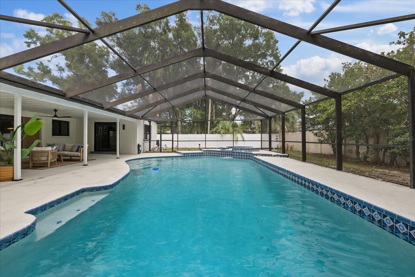 Welcome to this beautifully remodeled 4-bedroom, 2-bath, 2-car garage pool home in the highly desirable Lake Padgett Estates! Thoughtfully updated from top to bottom, this move-in ready home offers the perfect combination of modern style, comfort, and Florida living.

Major improvements include a new roof, hurricane-impact windows and doors throughout, and a newly resurfaced pool and pool deck, providing both peace of mind and lasting value.

The spacious open-concept floor plan creates an inviting atmosphere that's perfect for everyday living and entertaining. The living areas flow seamlessly to the large covered lanai and screened pool, creating the ideal indoor-outdoor lifestyle for relaxing, hosting family gatherings, or enjoying weekends with friends.

The private primary suite is a true retreat, featuring a beautifully updated en-suite bathroom, a generous walk-in closet, and a versatile bonus space that can be used as a home office, sitting room, dressing area, nursery, or reading nook. Private access to the patio and pool adds to the suite's appeal.

Situated in one of Land O' Lakes' most sought-after communities, Lake Padgett Estates offers an exceptional lifestyle surrounded by lakes, parks, and outdoor recreation. Close to three lakefront parks featuring playgrounds, basketball and volleyball courts, boat and kayak launches, picnic shelters, and plenty of green space for outdoor fun.

Just two miles away, the 79-acre Land O' Lakes Recreation Complex offers something for everyone, including baseball, football, and soccer fields, indoor and outdoor basketball courts, tennis courts, indoor volleyball, a gymnasium, skate park, swimming pool, playgrounds, and year-round community activities.

Conveniently located near shopping, dining, major roadways, and highly rated schools, this exceptional home offers everything you've been looking for. Schedule your private showing today and discover why so many love calling Lake Padgett Estates home.