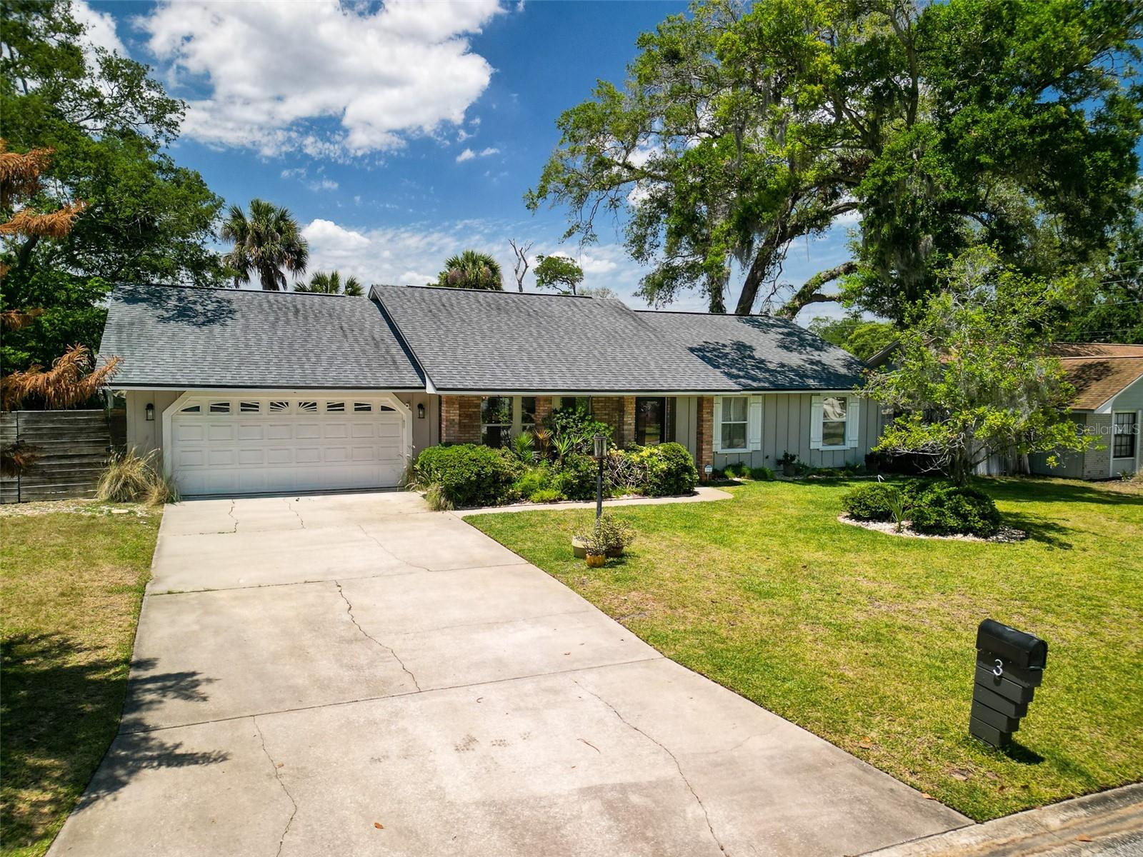 Under contract-accepting backup offers. Coastal charm meets everyday comfort in this beautifully maintained 3-bedroom, 2-bath single-family home featuring a screened inground saltwater pool and thoughtful indoor-outdoor living spaces throughout. Relax on the inviting covered front porch with tongue-and-groove ceiling and attractive brick exterior accents, or unwind poolside in the private fenced backyard complete with a side deck and storage shed. Inside, the open-concept layout offers a spacious kitchen with a large island, stainless steel appliances, dedicated coffee bar, and a versatile walk-in pantry that can also serve as extra storage or a home office space. Kitchen is open to the living and dining areas and feature light coloring and crown molding throughout. French Doors from the dining room provide easy access to the covered lanai and pool. The primary suite is designed for comfort with an ensuite bath featuring a walk-in shower and private access to the pool area for seamless indoor-outdoor living. A 2-car garage provides added convenience, while a peek of the Intracoastal from the front yard adds to the home's coastal appeal. Roof 2017, WH 2021, A/C 2017