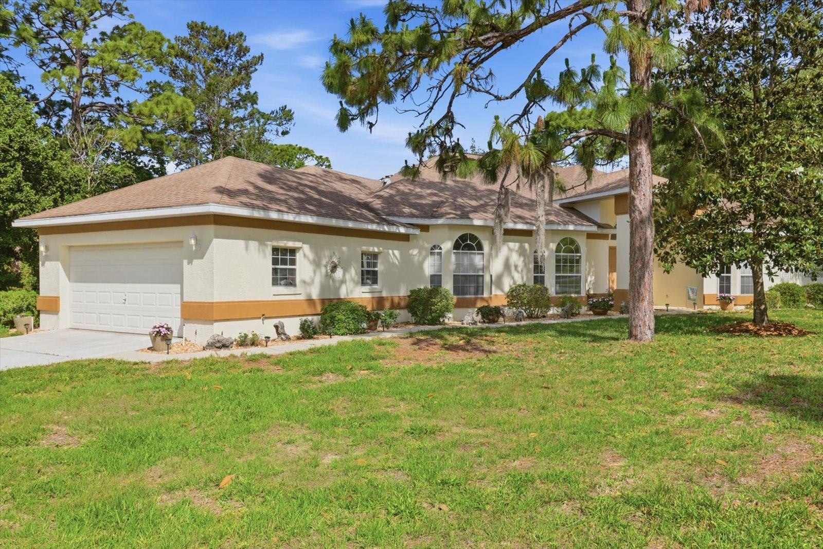 Designed to Impress, Built to Last. Custom Pool Home in Sugarmill Woods – Oak Village Cul-de-Sac. Step through grand double doors into this custom-built, one-owner home, where elegance and thoughtful design welcome you with formal living and dining rooms with great entertaining space. The desirable split floor plan offers privacy, featuring an extra-large owner’s suite with direct access to a office— for working from home or a quiet retreat. At the heart of the home is a spacious kitchen with island and breakfast bar, complemented by an aquarium-style glass breakfast nook that overlooks the inviting pool and cascading rock waterfall feature. Just off the kitchen, the family room with a custom fireplace creates a warm and comfortable gathering space. Pocket doors lead to a guest wing with two bedrooms and a pool bath, offering convenience and separation for family or visitors. Additional highlights include a butler’s pantry, bonus room, and a large indoor laundry room, providing both functionality and flexibility. This beautifully maintained home blends comfort, style, and indoor-outdoor living—perfectly positioned on a quiet cul-de-sac in sought-after Sugarmill Woods Oak Village.