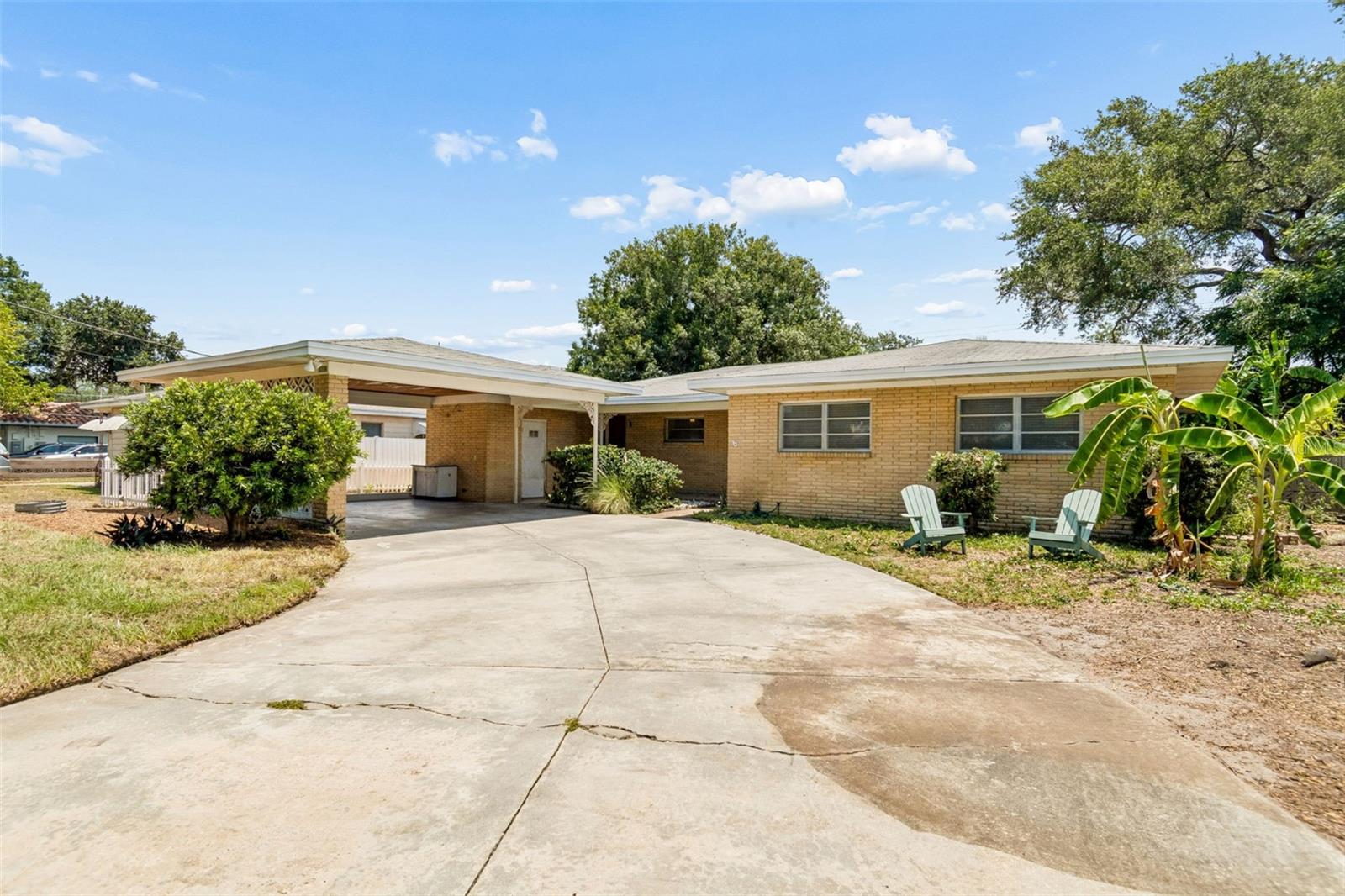 Welcome to this charming mid-century modern gem nestled on an oversized 75’ x 136’ lot in the highly sought-after Grady, Coleman, and Plant school district. Brimming with character, this home showcases many of its original architectural details, offering the perfect blend of timeless design and endless potential. Inside, you’ll find 3 bedrooms, 2.5 bathrooms, a dedicated laundry room, and inviting living spaces filled with warmth and natural light. The screened Florida room provides the perfect place to enjoy your morning coffee, unwind with a book, or entertain while overlooking the lush backyard. Step outside into your own tropical retreat featuring an incredible collection of mature fruit trees and tropical landscaping, including mango, papaya, banana, moringa, and hibiscus, creating a peaceful, private setting that’s hard to find in South Tampa. A brand-new roof is scheduled to be installed, offering added value and peace of mind for the future owner. Situated on a quiet street, yet just minutes from premier shopping, local dining, parks, the library, downtown Tampa, Tampa International Airport, and everything South Tampa has to offer, this location truly delivers the best of convenience and lifestyle.Whether you’re looking to preserve its authentic mid-century charm, thoughtfully renovate, or build your dream home on an exceptional homesite, this is a rare opportunity in one of Tampa’s most desirable neighborhoods.