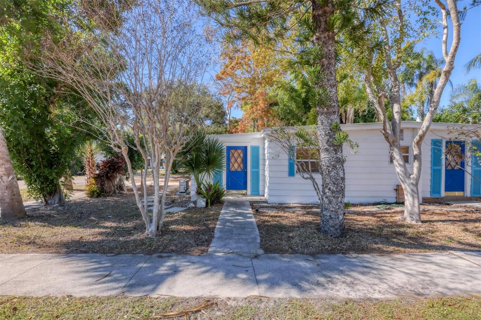 A Piece of Sarasota History Meets Modern Opportunity:  The "Siesta Key Style" Duplex with TWO separate electrical panels!

Own a landmark piece of Sarasota history. Nestled on an expansive, wooded double lot at the western end of Wilkinson Road, this "Siesta Key style" bungalow offers a rare blend of timeless character and modern updates. Surrounded by a lush, quarter-acre canopy of mature bamboo, majestic oaks, and tropical palms, this property is a private sanctuary just minutes from the best of the Gulf Coast. Two units, endless potential and fully remodeled between 2023 and 2024, this versatile duplex is an ideal setup for savvy investors, multi-generational families, or those looking to "house-hack".  

Unit 1: A spacious 2-bedroom, 2-bathroom layout.  Unit 2: A charming 1-bedroom, 1-bathroom retreat.  

Modern Upgrades & Peace of Mind:  Every major system has been addressed so you can enjoy "turn-key" living or immediate rental income.  Roof: New commercial-grade TPO membrane roof (2022) with a 30-year life.  Climate: Brand new, energy-efficient mini-split AC systems in both units.  Infrastructure: New plumbing throughout and separate electrical panels for each side.  Interior: A fresh mix of new and restored flooring, newer appliances in unit 1, and stylish finishes.  Exterior: Extra storage in the outdoor shed and plenty of room to roam & garden on the oversized lot.  

Location is Everything!!! Whether you’re heading to the beach, to work or to the city, you are perfectly positioned:  5 Minutes to the North Siesta Key Bridge. 12 Minutes to the vibrant culture and dining in Downtown Sarasota.  11 Minutes to the freeway for easy commuting.  Don't miss this rare chance to own a functional, fully updated landmark in one of Sarasota’s most convenient locations. 

Some photos are visually staged.

Schedule your private tour today!