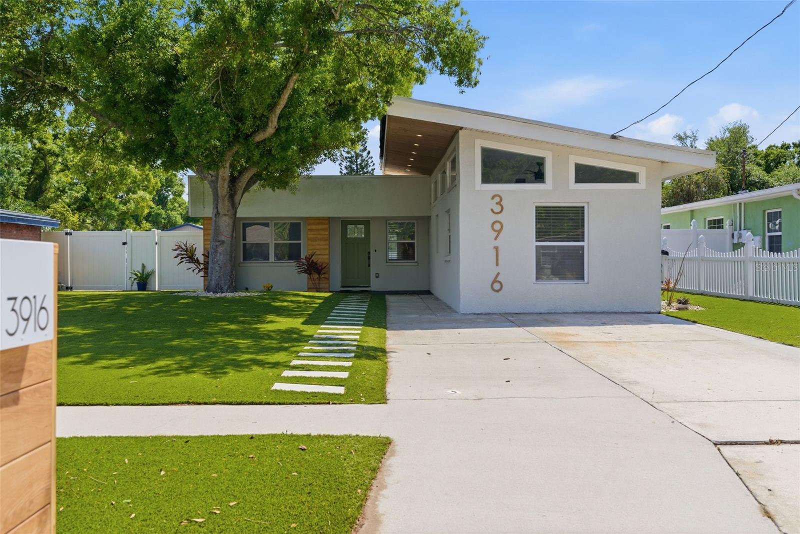 Located in a non-flood zone in the heart of South Tampa, you will find a home where contemporary style meets timeless mid-century modern design. This one story, concrete block home has been beautifully renovated and is move-in ready! Ideally located just one mile from MacDill Air Force Base, this move-in-ready residence offers exceptional convenience with quick access to the Selmon Expressway, Gandy Bridge, Downtown Tampa, Tampa General Hospital, Bayshore Boulevard, shopping, dining, and more.Inside, you'll find a bright, open-concept floor plan designed for today's lifestyle. The fully remodeled kitchen, with stainless steel appliances and white shaker cabinetry, flows seamlessly into the main living areas, creating the perfect space for everyday living and entertaining.  Thoughtfully updated throughout, the home showcases clean lines, modern finishes, and an abundance of natural light. The spacious primary suite serves as a relaxing retreat with volume ceiling and an ensuite bath with dual sinks and oversized step-in shower. You will llove the spacious walk-in closet!Two additional bedrooms offer flexibility for family, guests, or work from home space. Open the french doors to a large, fully vinyl privacy fenced backyard with endless possibilities. Whether you envision adding a pool, creating an outdoor kitchen, gardening, or simply enjoying the privacy, this oversized outdoor space is ready to become your personal Florida oasis. Located in one of South Tampa's most convenient areas, this home offers the perfect combination of style, functionality, and location. Don't miss your opportunity to own this turnkey property in the heart of Tampa.