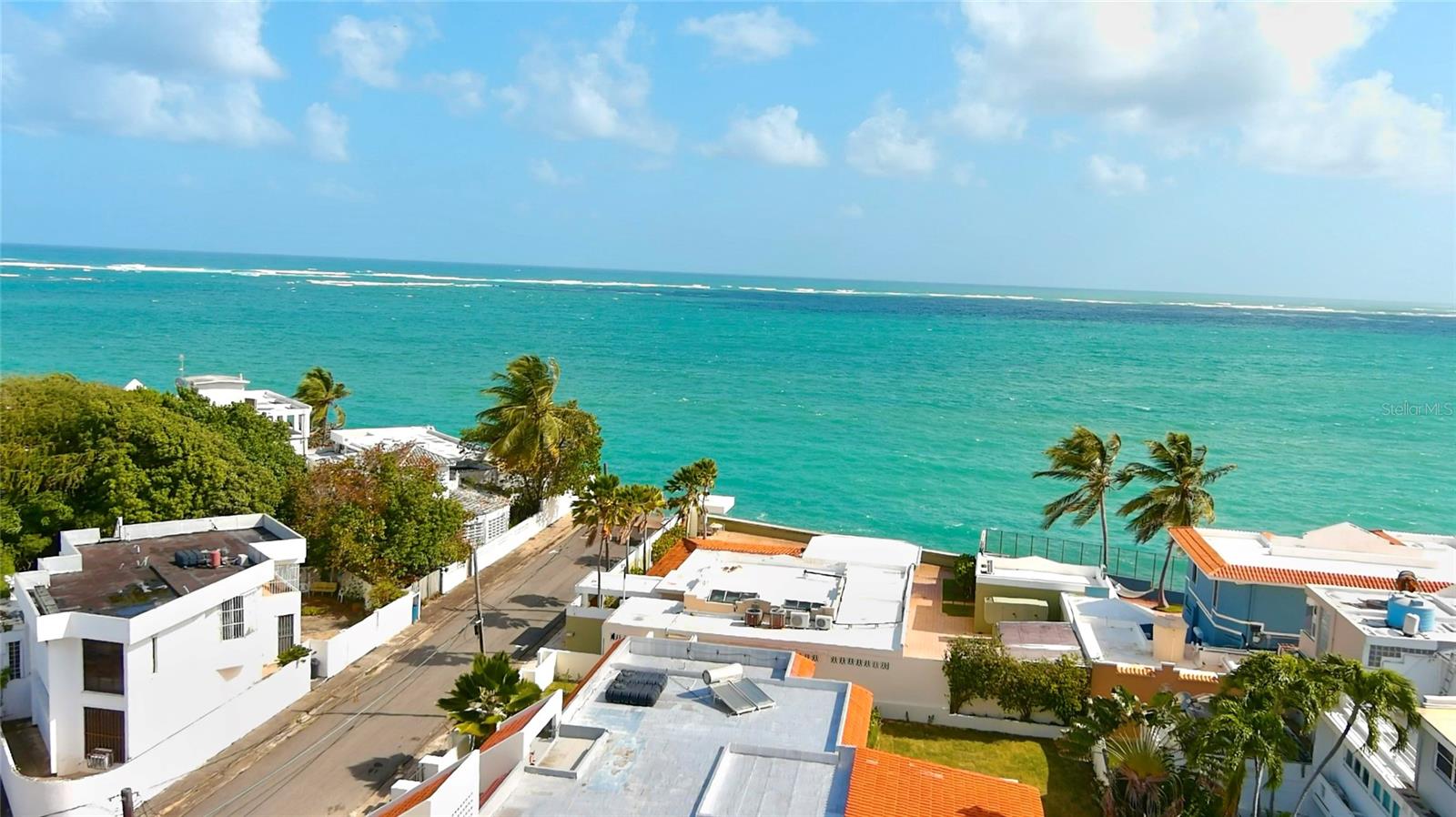 Enjoy life in San Juan's most exclusive oceanfront 24-hour gated community. This one story residence was recently renovated by an architect with new windows, new kitchen and appliances, all new bathrooms, a brand new pool, generator among other fine details. Enviably situated only a house away from the ocean, this home enjoys ocean views from it's roof top and marvelous ocean breezes from every corner. This turnkey house boasts 3 bedrooms and 3 baths with an additional fourth bedroom that could be a guest room, caretaker's room, or an office. The all new modern kitchen opens into the dining room and bar, which seamlessly connect to the living room creating the perfect open concept living area. An adjacent large terrace overlooks the pool, surrounded also by an impressive green lawn, all perfect for entertaining or children's recreation. A 2-car garage, laundry, a generator, a cistern and solar water heater complete this great home. The Punta Las Marias area has long been an exclusive local neighborhood and is living a revival with most homes being renovated or newly constructed. HOA is $120 a month. It is near many restaurants, top private schools, and beautiful beaches. The area is perfect to practice many aquatic sports such as surfing, paddle boarding, fishing, windsurfing, and a lifestyle like no other.