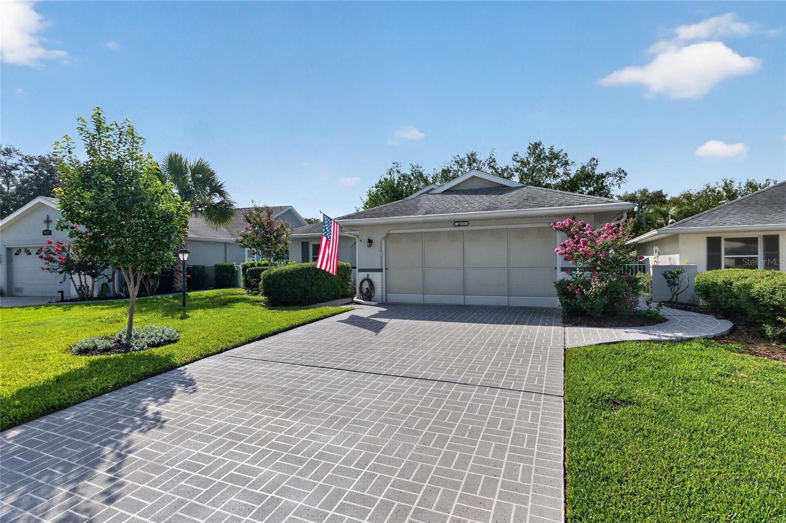 ELEVATED HOMESITE | EXPANDED FLORIDA ROOM | PRIVATE COURTYARD

Spacious Washington model offering 1,777 sq. ft. of living space in the desirable Williamsburg neighborhood of On Top of the World. This 2-bedroom, 2-bath home features an oversized great room with an open living and dining area, and a true split-bedroom floor plan.

The kitchen offers wood cabinetry, a pantry, stainless-steel appliances and a breakfast area. An extended, same-level enclosed Florida room with large sliding windows provides additional year-round living space to be used as craft, office or flex room, while the adjoining tiled enclosed porch overlooks a private courtyard. Situated on an elevated homesite, the backyard enjoys expanded views and enhanced privacy from the rear neighboring homes.

A pocket door separates the guest bedroom and guest bath from the main living area, creating a private guest suite. The spacious primary suite features a walk-in closet, dual-sink vanity, and a step-in shower. The Maytag washer and dryer are conveniently located inside the home (not in garage) Additional features include an epoxy-coated garage floor, built-in garage shelving and cabinets, gutters and flat driveway.

Enjoy the convenience of lawn mowing and shrub trimming included in the HOA, along with all the resort-style amenities of On Top of the World, including golf, indoor and outdoor pools, fitness centers, pickleball, countless clubs and activities, and golf cart access to nearby shopping and dining.
