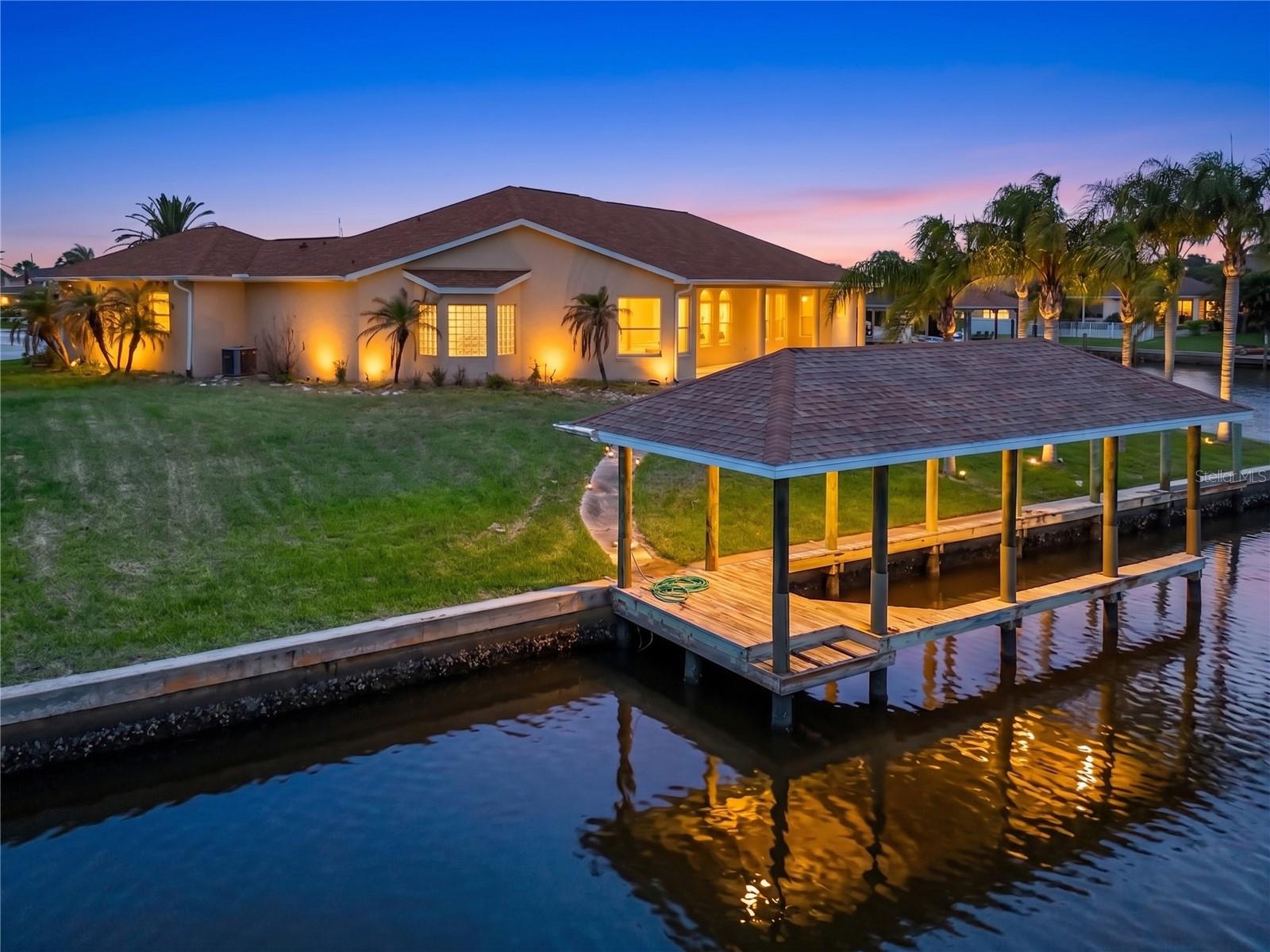 Welcome to this exceptional waterfront residence located in desirable Sailboat Country, offering direct access to open water with no fixed bridges. Designed for both everyday living and entertaining, this beautifully maintained home showcases quality craftsmanship and thoughtful upgrades throughout.

Step inside to discover custom cabinetry, elegant crown molding, and spacious living areas filled with natural light. The well-appointed kitchen features abundant storage, premium finishes, and seamless flow into the main living and dining spaces.

The spacious primary suite provides a private retreat, while two guest bedrooms are connected by a convenient Jack and Jill bathroom, creating the perfect layout for family and guests. An additional bedroom/office and half bath along with flexible living spaces offer comfort and functionality for every lifestyle.

Outdoor living is where this home truly shines. Enjoy stunning waterfront views, a private dock, and easy sailboat access to the Intracoastal Waterway and beyond. Whether you're boating, fishing, or simply relaxing by the water, this property delivers the ultimate Florida lifestyle.

Situated in a sought-after waterfront neighborhood close to shopping, dining, golf, beaches, and top local amenities, this rare Sailboat Country opportunity combines luxury, convenience, and exceptional boating access.

Schedule your private showing today and experience waterfront living at its finest.