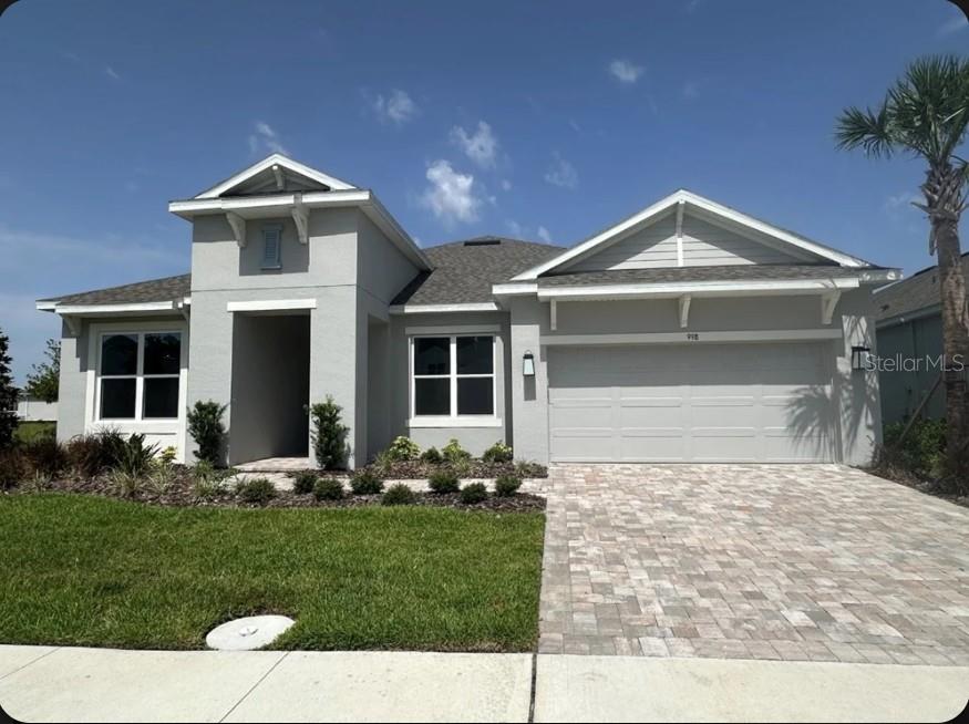 What's Special: Larger Backyard | Lake View | Dedicated Study. New Construction - Ready Now! Built by America's Most Trusted Home Builder. Welcome to the Letizia at 998 Tassleflower Trail in Esplanade at Center Lake Ranch! This thoughtfully designed single-story home offers the perfect blend of comfort and flexibility with four bedrooms, three full baths, and a private study just off the foyer. The open-concept great room flows seamlessly into the spacious gourmet kitchen and dining area, creating a bright and welcoming space for everyday living and entertaining. A covered lanai with pavers extends the living area outdoors, while the private primary suite features a spa-inspired bath, dual vanities, a walk-in closet, and a peaceful retreat from the rest of the home. Secondary bedrooms are thoughtfully positioned to provide privacy for family members and guests, and a convenient drop zone, laundry room, and abundant storage help keep daily routines organized. A two-car garage completes this beautifully designed home. Additional Highlights Include: 8' interior doors, pre-plumb for future laundry sink, and tray ceilings in great room, dining room, primary suite and study. MLS#O6425302
Experience resort-style living in St. Cloud, Florida, at Esplanade within the gated Center Lake Ranch community. With homes offering stunning nature and pond views, every detail is designed for peace and relaxation. Enjoy wellness-focused amenities like a pool, spa, fitness center, and movement studio. Stay active with pickleball, bocce, or strolls through the Bark Park, while concierge services and community events keep life exciting. With planned trails, parks, and an 11-acre Central Park, Esplanade offers a serene, nature-filled lifestyle with easy access to major roads.