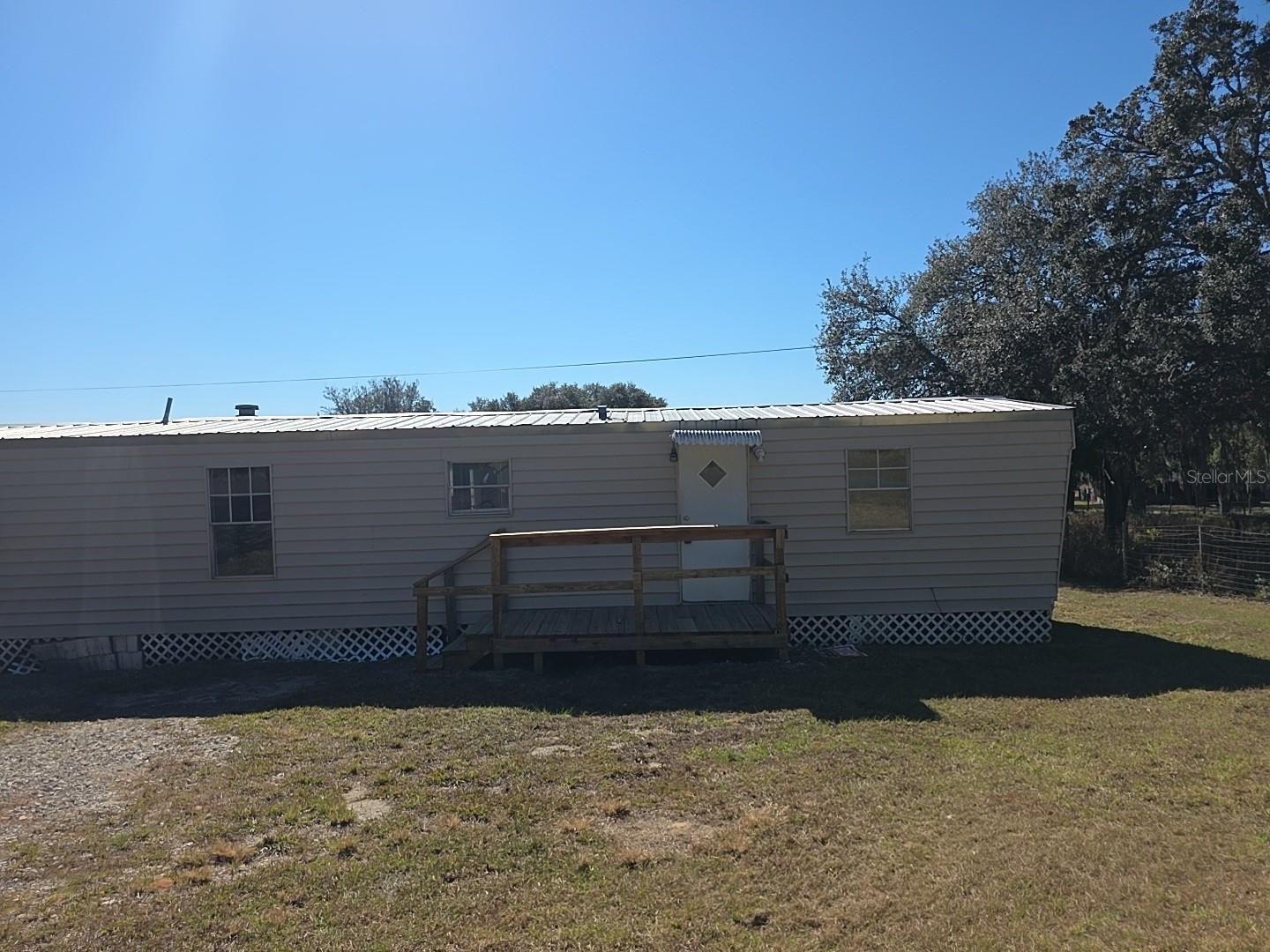 Rare opportunity to own two adjacent properties totaling nearly 8 acres in the heart of Lecanto! This unique offering includes two manufactured homes on separate parcels—ideal for multi-generational living, rental income, or a private family compound. Enjoy plenty of room for horses, farm animals, RVs, boats, workshops, barns, or future expansion. The peaceful country setting offers privacy without sacrificing convenience, with shopping, restaurants, medical facilities, schools, and the Suncoast Parkway just minutes away. Whether you're looking for an investment property, homestead, or land with endless potential, this versatile property is ready for your vision. No HOA and plenty of space to live, work, and play.