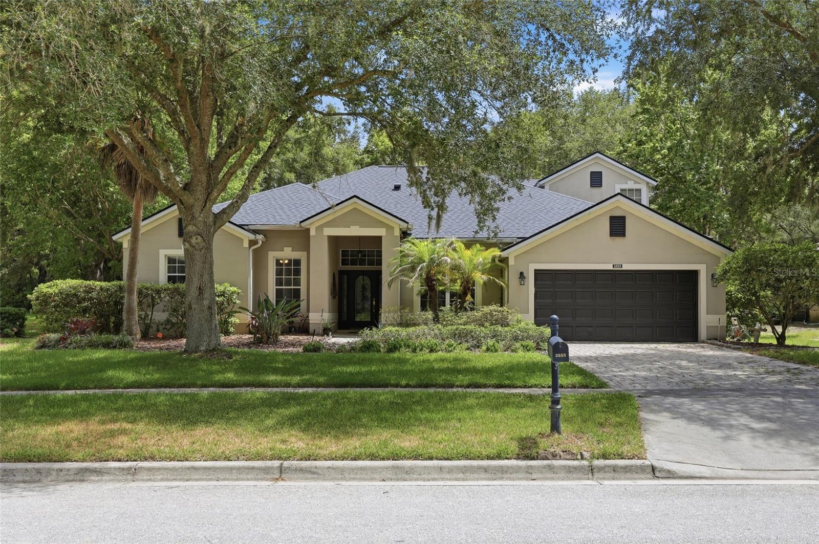 Welcome to this meticulously maintained, spacious 4 bedroom, 3 bath home set on a generous .30 acre lot in Rock Springs Ridge, offering plenty of room to spread out both inside and out, with no rear neighbors for added privacy. Lush landscaping with colorful flowers lines the front yard for maximum curb appeal. Inside, an expansive and well-designed floorplan features arched entryways, crown molding, and a mix of ceramic tile and bamboo flooring ideal for a growing family that needs room to grow. Formal living and dining rooms flank the foyer, leading into a wide-open kitchen anchored by beautiful quartz countertops, stainless steel appliances, 42" cabinets, a built-in desk area, eat-in bar, and adjacent breakfast nook plenty of space for cooking, gathering, and everyday living.
The oversized master suite opens directly to the lanai, and the spa-like master bath offers cultured marble dual-sink counters, a soaking tub, glass-enclosed shower, and separate water closet for extra privacy. The garage is oversized too, at a full 25 feet deep, giving you added storage or workspace beyond a typical two-car layout. Step out onto the screened lanai to take in peaceful views of the large backyard with no rear neighbors and a third of an acre to enjoy, it's a rare stretch of space and quiet in this desirable community.
Beyond the home itself, Rock Springs Ridge offers a lifestyle to match: residents will soon be able to enjoy a 27-hole championship golf course with clubhouse dining, scenic rolling terrain that's uncommon for Florida, walking and biking trails, and beautifully landscaped parks and playgrounds. The community's rolling hills and green spaces backs up to conservation areas near Wekiwa Springs State Park, giving many homeowners a true nature-meets-suburbia feel, and an active HOA keeps common areas well maintained. 
Zoned to Kelly Park K-8 A rated schools and just minutes from Apopka's Northwest Recreation Complex with baseball fields, a playground, walking trails, an amphitheater, and more this home also offers easy access to shopping, dining, medical facilities, and everything Central Florida has to enjoy. Call now to schedule your showing!