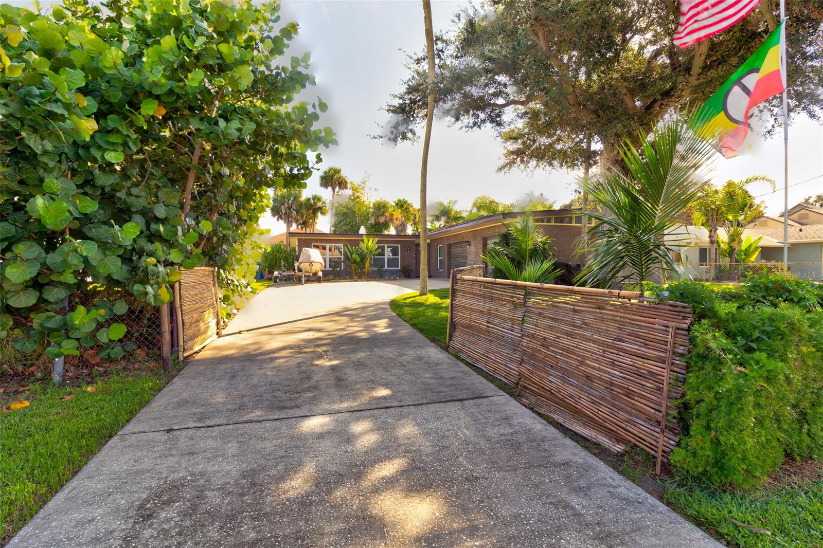 Beautiful beachside pool home steps to the nearest beach access, as well as a short walk to canal access kayak, paddle board, or boat launch. Fully fenced backyard and front yard, plus screened pool offers a serene setting for outdoor living and enjoying ocean breezes in a tropical setting. Updated kitchen and appliances, and an open floor plan. Terrazzo floors throughout the living room and vinyl plank floors in the bedrooms. The home is a three bedroom with a bonus room currently being used as a bedroom. Laundry/mudroom plus an oversize two car garage. Brand new 2020 modified butimen roof, AC replaced in 2018, windows replaced in 2016, water heater 2019. Move in and enjoy! ;Water: City