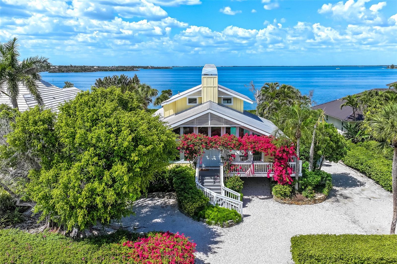 Experience waterfront living in this recently updated Boca Grande residence, ideally positioned along the serene shores of Gasparilla Sound. This four-bedroom, four-bath pool home  blends timeless coastal charm with thoughtful modern upgrades, starting with its inviting curb appeal and welcoming entry.
Inside,  elegant shiplap detailing enhances the interior walls, adding warmth and character throughout. The home features an updated kitchen and breakfast room with stunning water views. The second-floor primary suite serves as a private retreat, complete with a updated bath and its own waterfront deck. Three additional bedrooms, two en suite, offer private entrances off the pool, creating a perfect setup for guests or extended family.  Some Storm-resistant doors were added and the windows flood the home with natural light while providing peace of mind and added protection.
Step outside to embrace the ultimate waterfront lifestyle. The expansive pool area overlooks the water, complemented by a private boardwalk and dock—ideal for kayaks, paddleboards, fishing, or simply enjoying breathtaking sunsets.
This exceptional property is a perfect opportunity to own an island home in Boca Grande —where comfort, and coastal beauty come together seamlessly.