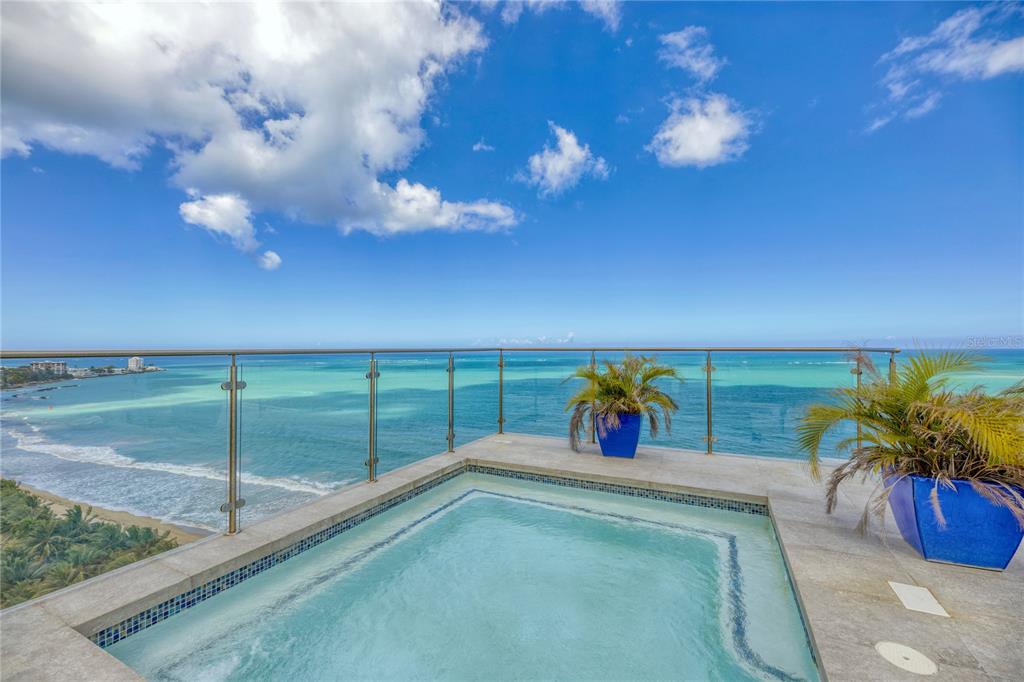 Updated in 2018, this unique, turnkey convertible 4 bedroom + den, 3.5 bathroom, approx. 4,365 sq. ft. two-story penthouse represents all that you can expect from beachfront living in Puerto Rico. 

Oceanfront and rolling directly onto the sand, the unobstructed, panoramic northern exposure views draw you towards the expansive floor plan that culminates at the rare to find exclusive rooftop space only available here at Plaza Atlantico. 

Pristine marble floors as well as double height windows expand throughout the open living, formal dining and family room. The brand new spacious designer kitchen, favoring the spectacular ocean landscape, is fully equipped with a water filtration system, custom cabinetry and top of the line appliances. The complete laundry suite has been retrofitted with water softening technology as well as custom cabinetry.

The en-suite master bedroom with large walk-in closet offers hardwood floors, as well as stand-alone basin tub and shower. The two additional bedrooms share a full bath. Den and office, showcase ocean views.

On the second level, a redesigned rooftop terrace features its own private pool with sunning areas and full bath, indoor/outdoor full chef’s kitchen inclusive of living, entertaining and dining space, all highlighting the horizon of the magnificent Atlantic Ocean.

With only 2 apartments per floor, Plaza Atlantico offers privacy, full back-up generator and water cistern, 24-hour guard, direct beach access and 3 garage parking spaces. The beach is your backyard, making this the perfect penthouse for entertaining and enjoying the laid back lifestyle the Island offers.

Monthly Condo Fee: $1,250