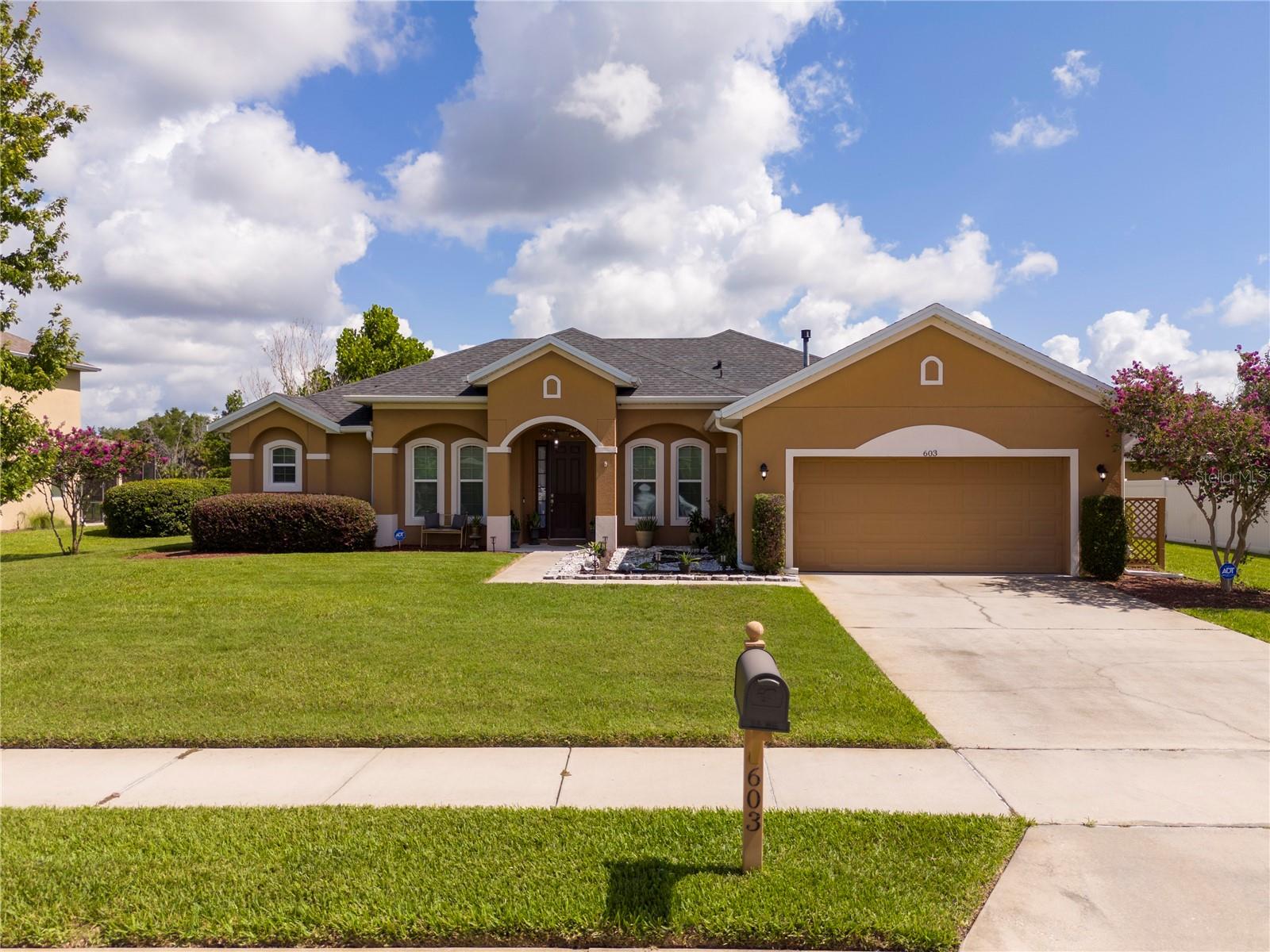 Virtually Staged. Welcome to this beautifully maintained 4-bedroom, 2-bathroom home offering over 2,200 square feet of living space in one of DeLand's desirable established communities. Situated on an oversized 0.28-acre lot with serene pond views, this home combines comfort, functionality, and outdoor enjoyment.

Step inside to discover a spacious open-concept layout featuring high ceilings, abundant natural light, and a split-bedroom floor plan designed for privacy and everyday living. The large kitchen overlooks the main living areas and offers ample cabinetry, generous counter space, and a convenient eat-in area, making it perfect for entertaining and family gatherings. Granite and solid-surface countertops, walk-in closets, and thoughtful upgrades throughout add both style and convenience.

The expansive primary suite provides a relaxing retreat, while the additional bedrooms offer flexibility for guests, a home office, or growing families. Enjoy your morning coffee or evening sunsets from the screened lanai overlooking the peaceful pond, creating the perfect setting for year-round Florida living.

Additional highlights include a tankless gas water heater, irrigation system, rain gutters, a 2-car garage, and mature landscaping. Conveniently located near shopping, dining, schools, parks, downtown DeLand, and with easy access to major highways, this home offers the ideal balance of tranquility and accessibility.

Don't miss this opportunity to own a spacious pond-view home on an oversized lot in the heart of DeLand—schedule your private showing today!