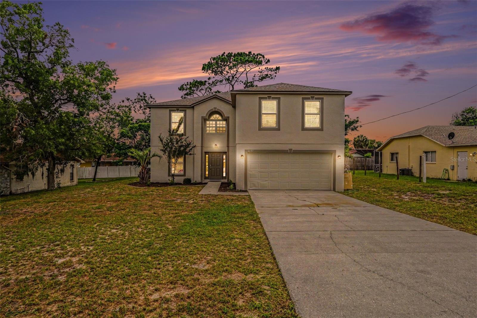 Want a home that looks and feels like new construction, but doesn't come with new community HOA fees? This 4-bedroom, 2.5-bath single-family home has been completely renovated from top to bottom. Recent updates include a new roof, fresh interior and exterior paint, all new flooring, cabinetry, and stainless steel appliances, creating a clean, modern feel throughout.

The open main living area flows into a bright kitchen featuring white shaker cabinets, solid surface countertops, a subway tile backsplash, recessed lighting, and a large sliding glass door that brings in natural light and provides easy access to the backyard. The home also includes a two-car garage and updated finishes throughout.

Outside, the backyard offers plenty of room to create your ideal outdoor living space, whether you envision a patio, garden, or play area. Mature trees add character and shade, while the refreshed exterior gives the home strong curb appeal.

Located in Spring Hill, this home offers convenient access to shopping, restaurants, parks, medical facilities, and the Suncoast Parkway for an easy commute to Tampa and surrounding areas. With no HOA fees associated with a new construction community, you can enjoy the benefits of a fully renovated home without the added monthly expense.