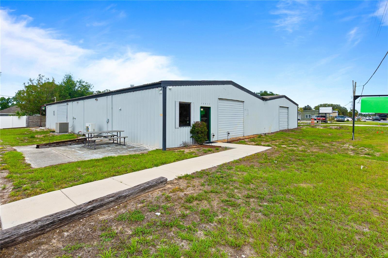 FOR LEASE OR SALE. Versatile industrial flex property offering approximately 6,440± SF consisting of approx 1,500± SF of office space, 4,200± SF of warehouse space, and an additional 800± SF of climate-controlled storage/workspace, ideally suited for contractors, service businesses, light industrial users, distribution operations, and storage needs.

The office area features a functional layout with five private offices, a reception area, and a kitchenette/conference room, providing a professional environment for administrative and client-facing operations. The warehouse offers approximately 4,200± SF of non-climate-controlled space with clear heights ranging from approximately 9'8" to 9'10", complemented by multiple grade-level roll-up doors for efficient loading and operational flexibility.

In addition to the warehouse, the property includes approximately 800± SF of climate-controlled storage/workspace, providing an ideal solution for inventory, equipment, records storage, or operations requiring conditioned space. Additional amenities include a climate-controlled warehouse restroom, 100 SF climate controlled storage closet, washer/dryer hookups, and a covered outdoor patio/work area for added functionality.

Situated on nearly one-half acre, the property provides ample on-site parking and maneuvering area for employees, customers, service vehicles, and day-to-day operations. Industrial and light manufacturing properties of this size and configuration are increasingly difficult to find in today's market. Scheduled to be available for occupancy in Q3/Q4 2026, this offering presents an excellent opportunity for businesses looking to secure quality industrial space in advance. Additional warehouse space is also available nearby also for lease/sale for tenants / buyers seeking future expansion opportunities. Please refer to MLS #G5113236 for additional details.