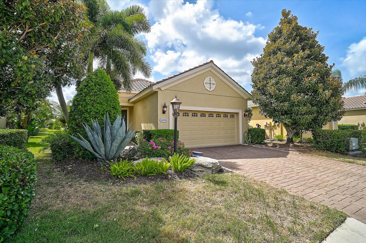 Perfectly positioned to capture breathtaking long lake views, this beautiful residence offers the ideal blend of comfort, functionality, and Florida living.

Featuring 2 bedrooms, 2 bathrooms, a dedicated office/den, and a spacious 2-car garage, this home is designed for both everyday enjoyment and effortless entertaining. From the moment you enter, your eyes are drawn through the open-concept living space to the sparkling heated pool and expansive water views beyond. The seamless flow between the kitchen, dining area, and living room creates a bright and welcoming atmosphere, making it easy to stay connected with family and guests while enjoying the tranquil lakefront setting.

The kitchen offers abundant cabinetry, generous counter space, and a large pantry that provides exceptional storage. Whether preparing a casual breakfast or hosting holiday gatherings, you'll appreciate the thoughtful layout and convenient access to the main living areas.

Architectural details add character throughout the home, including elegant coffered ceilings in both the living room and the spacious primary suite. The owner's retreat is a peaceful sanctuary overlooking the water and features engineered hardwood flooring, large walk-in closets outfitted with custom built-in shelving and drawers, and a well-appointed ensuite bathroom with dual sinks, ample vanity space, and a walk-in shower.

Storage has been carefully considered throughout the home, with professionally designed closet systems maximizing every inch of available space. The office/den, also finished with engineered hardwood flooring, offers flexibility as a home office, hobby room, library, or guest space.

The home features solid surface flooring throughout, with ceramic tile in the main living areas and engineered hardwood in the primary bedroom and office, providing both beauty and ease of maintenance.

Step outside and discover one of the property's most impressive features. The heated pool overlooks a picturesque lake, creating the perfect setting to relax with a morning cup of coffee, entertain friends, or unwind while enjoying spectacular sunsets reflected across the water. The aluminum pool cage has been reinforced and updated to provide added confidence during Florida's storm season while preserving unobstructed views of the surrounding landscape.

Significant improvements have already been completed, allowing the next owner to move in with confidence. Impact-rated windows were installed in 2022, providing enhanced storm protection, energy efficiency, and peace of mind. A tankless water heater was installed in 2019, offering endless hot water and improved efficiency. Most recently, the air conditioning system was replaced in June 2026, ensuring years of dependable comfort.

The oversized 2-car garage is equally impressive, featuring a durable epoxy-coated floor and sturdy built-in hanging storage shelves that help keep tools, seasonal items, and household belongings neatly organized.

Opportunities like this are increasingly difficult to find—a home that has never before been offered for sale, thoughtfully updated, meticulously maintained, and positioned on a beautiful waterfront homesite. Whether you are seeking a full-time Florida residence a storm retreat from an island home or a seasonal retreat, this exceptional property offers the perfect combination of comfort, quality, and scenic beauty.