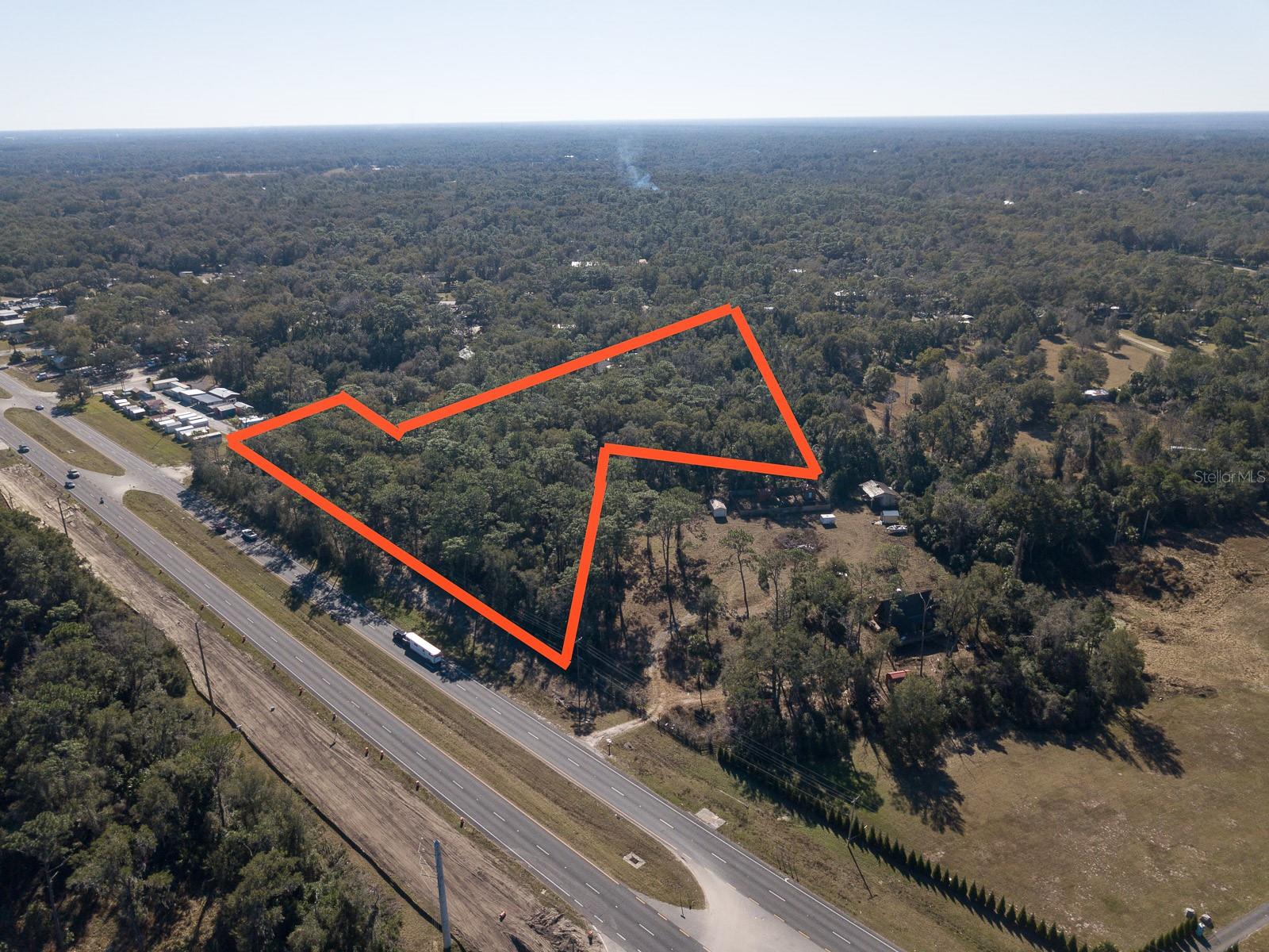 The possibilities are endless for this 5+ acres of vacant land located on North Hwy 17 with over 500 feet of highway frontage.  Property consists of 2 parcels to make up a total of just under 6 acres.  Property is located north of Spring Garden Ave Intersection.  Mixed zoning of Commercial (01B4) and transitional AG.  Recent survey available. City water available.