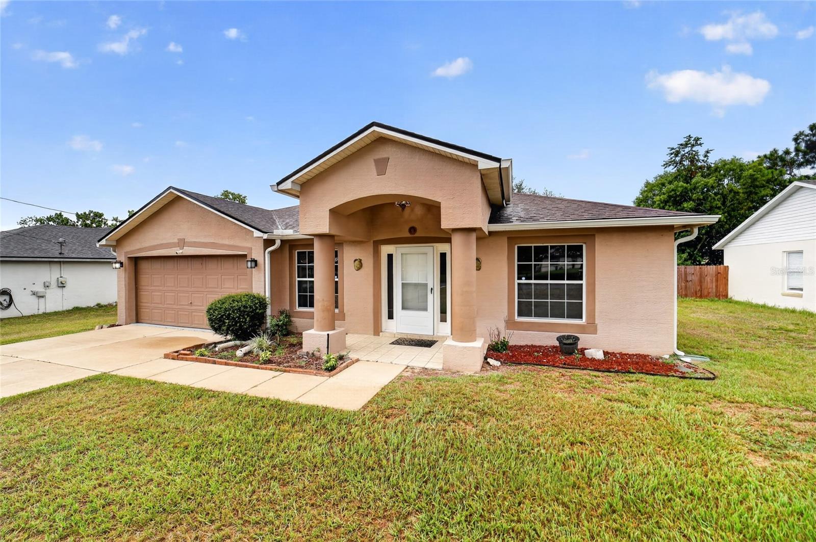 Beautifully updated 3-bedroom, 2-bath home in Silver Springs Shores offering 1,674 living square feet (2,054 total under roof). This well-maintained home features an inviting layout with a foyer, formal living room, dining room, higher ceilings, and plenty of natural light throughout.

The kitchen and both bathrooms were beautifully renovated in 2022. The kitchen features granite countertops, upgraded cabinetry, newer 2024 stainless steel appliances, and a spacious pantry. The primary suite offers a double-sink vanity, a relaxing soaking tub, and a separate shower, while the guest bathroom showcases a beautifully tiled walk-in shower.

Enjoy the enclosed lanai overlooking the fully fenced backyard with a white vinyl privacy fence installed in 2023—ideal for relaxing, entertaining, or giving pets room to roam.

Additional improvements include a 2021 roof, 2020 A/C, 2024 water heater, and a 2025 water softener, adding even more value and peace of mind.

Conveniently located near Publix, Walmart, Walgreens, restaurants, and other everyday conveniences, this move-in ready home offers the perfect combination of comfort, quality updates, and location. **Best of all, there's no HOA**, giving you the freedom to enjoy your property without additional fees or restrictions.