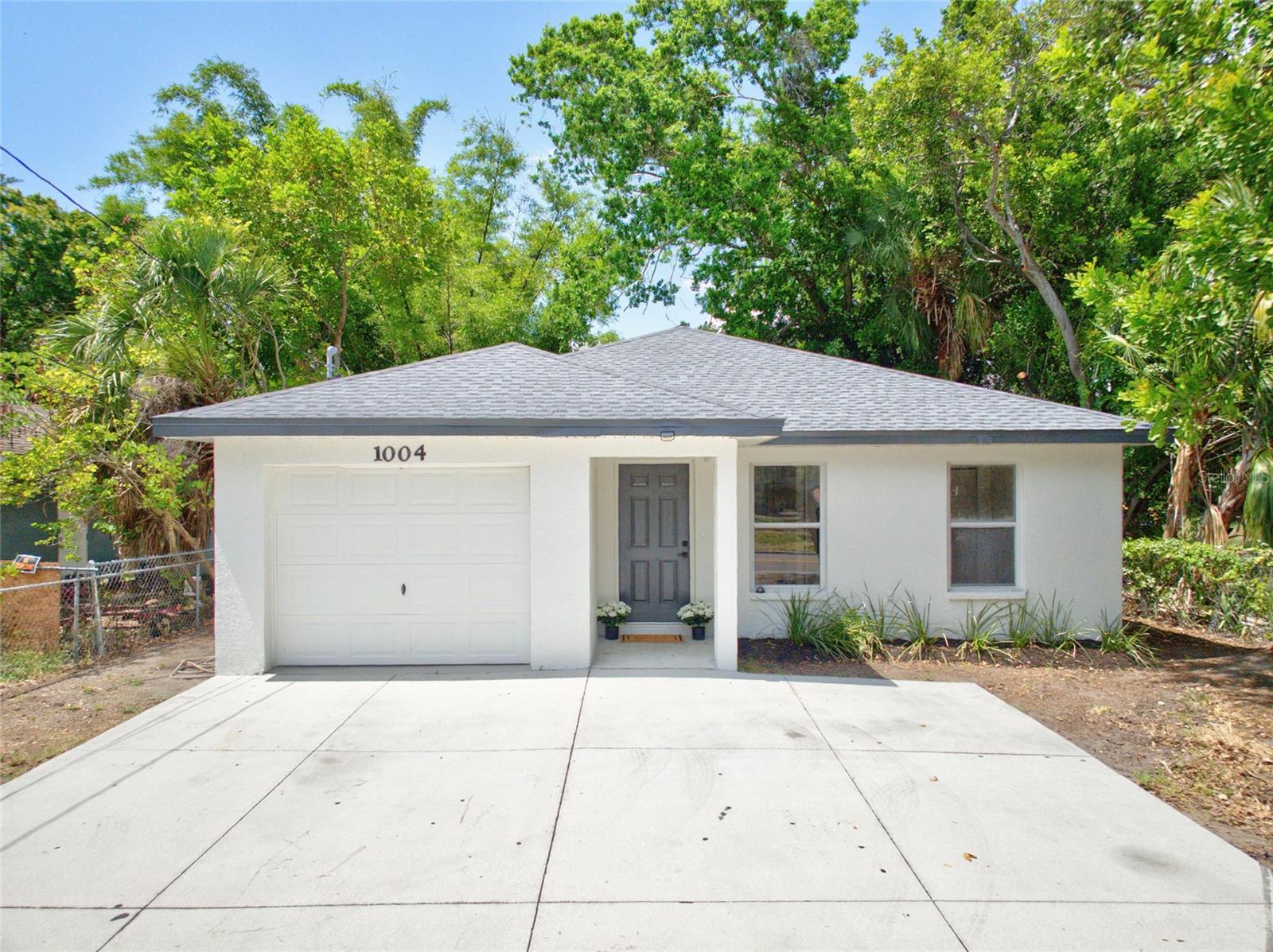 Welcome to this beautifully maintained 3-bedroom, 2-bath, 1-car garage concrete block home offering 1,124 square feet of comfortable living space. Built in 2003, this newer construction home provides the peace of mind of modern building standards and is further enhanced by a 2026 roof and a 2024 central heat and air system, with the HVAC recently serviced and the coils cleaned. Ideally located in the heart of Bradenton, you’ll enjoy being just minutes from downtown Bradenton, with convenient access to Lecom Park, the scenic Manatee Riverwalk, shopping, dining, entertainment, and quick access to I-275 for an easy commute to St. Petersburg and Tampa. Inside, the home showcases a clean, contemporary style with durable tile flooring throughout the main living areas and luxury vinyl plank flooring in all bedrooms. The kitchen features granite countertops, stainless steel appliances, and ample cabinet space, while both bathrooms have been tastefully updated with newer contemporary vanities and modern plumbing fixtures. The spacious one-car garage includes washer and dryer hookups, and the home’s newer construction means you’ll also benefit from newer, energy-efficient windows. Step outside to a fully fenced backyard complete with a concrete patio, offering plenty of room for pets, entertaining, gardening, or creating your own outdoor oasis. An extended driveway provides additional parking, making this move-in-ready home an excellent opportunity for first-time buyers, downsizers, or anyone looking for a low-maintenance home in a convenient Bradenton location.