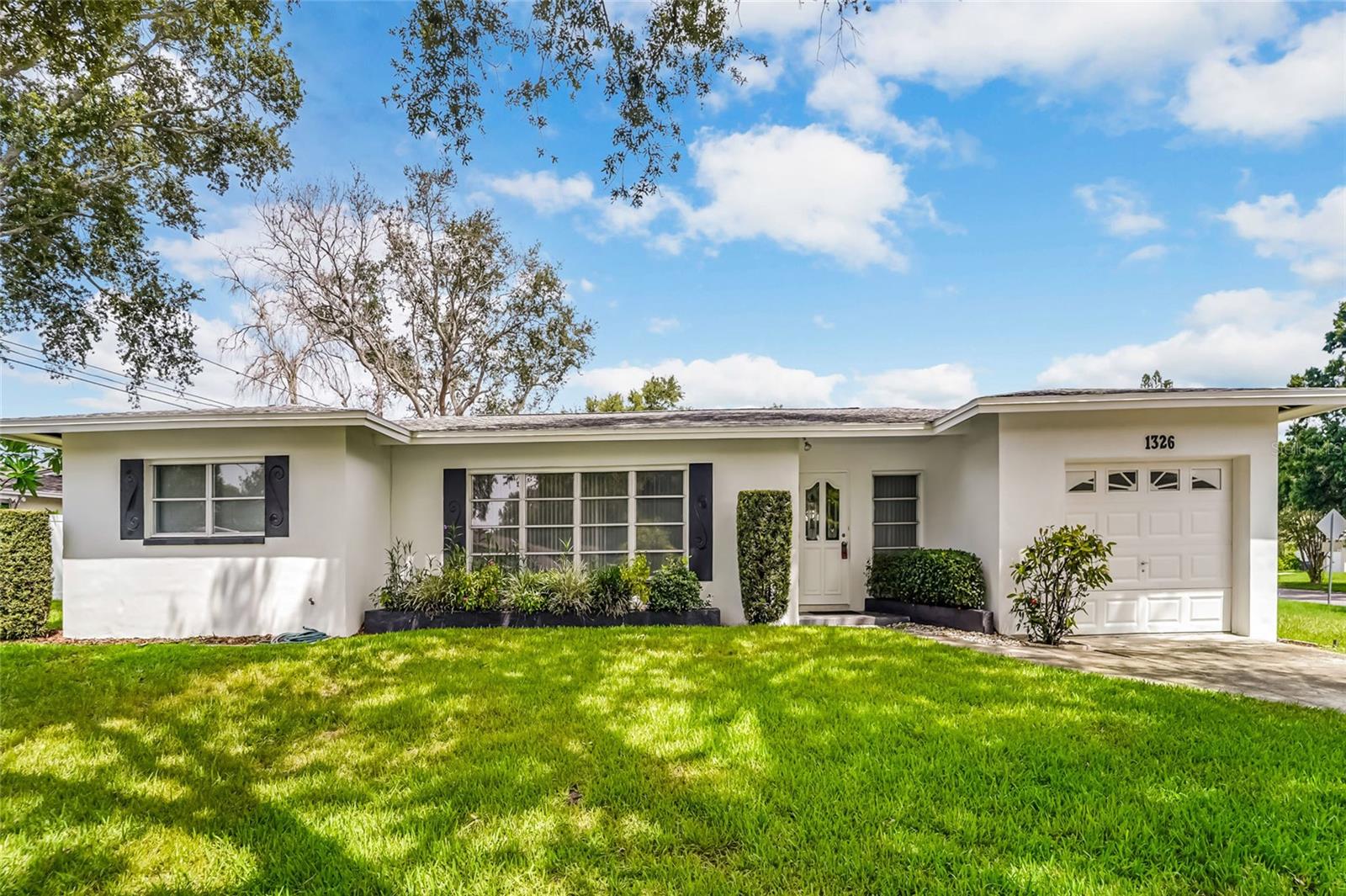 Endless Possibilities in the Heart of Clearwater! This cherished ONE-OWNER HOME, lovingly maintained by the same family since 1958, is ready for its next chapter.  Offering 1416 Sq Ft, 3 bedrooms, 2 Full Baths, a 1-Car garage, and situated on a Large, CORNER LOT, this property is a perfect opportunity to update and make it your own. The home features a desirable SPLIT Bedroom plan, a Y-Shaped driveway that provides convenient parking without having to tandem vehicles. Major updates include a 2020 ROOF, 2017 HVAC, and 85 feet of replaced sewer line in 2021. Property located in an X AND AE flood zone. Part of the garage is considered in a flood zone. Ideally located in the heart of Clearwater, you'll enjoy easy access to shopping, dining, parks, and the area's Gulf Coast.
You're just a short drive away from World Famous Clearwater Beach and 2 International Airports, making this an opportunity for a primary residence, seasonal home, or investment property.  Bring you imagination and transform this well-loved home into the home of your dreams!
