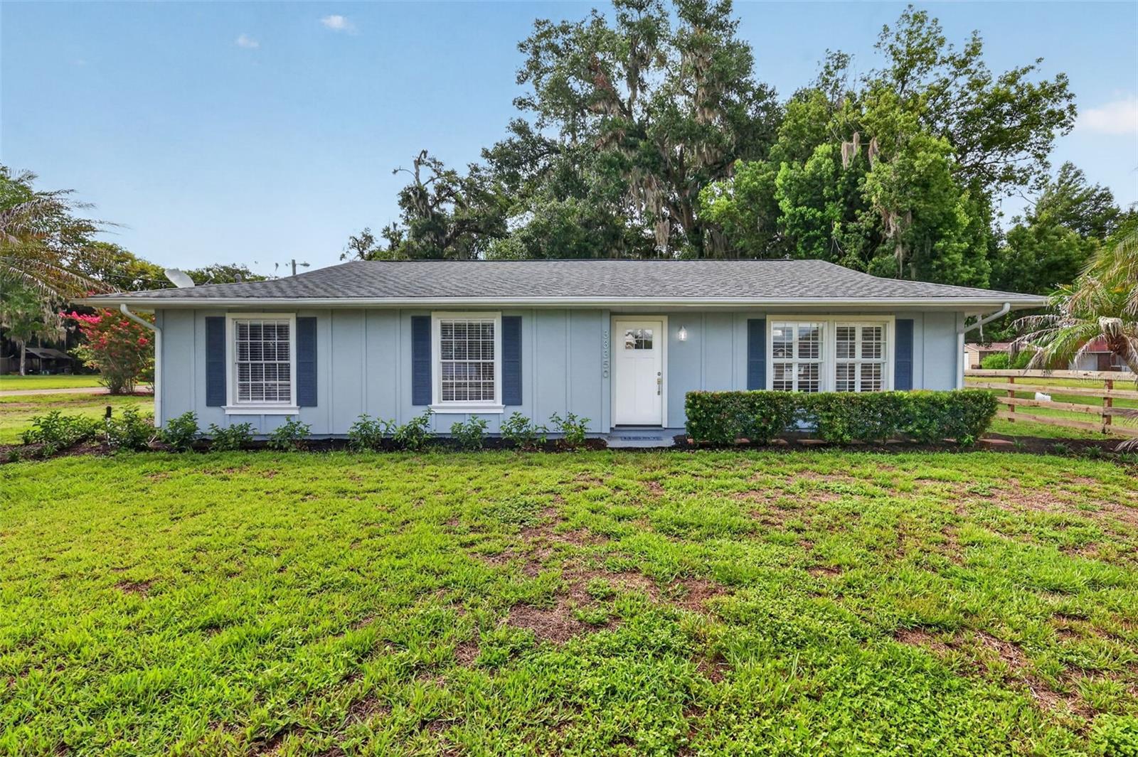 This One Has It All—Completely Remodeled, Move-In Ready & Lake Views! Welcome home to this beautifully remodeled three-bedroom home in a well-established, non-HOA community in Eustis. Perfectly situated on a spacious 0.44-acre corner lot with views of Lake Joanna, this charming cottage-style home offers the perfect blend of modern updates, functionality, and an unbeatable location. From the moment you arrive, you'll appreciate the modern updates. The property features an expansive driveway leading to a detached 20' x 32' garage/workshop with newly installed garage doors, plus a convenient parking pad and stone walkway providing easy access to the home. Step inside to discover a bright, freshly painted interior filled with natural light and thoughtful upgrades throughout. Recent improvements include a new front door, luxury vinyl plank wood-look flooring, crown molding and oversized baseboards, updated interior doors, modern lighting inside and out, attic insulation, water heater, a new drain field, and much more. The open, spacious floor plan is ideal for both everyday living and entertaining. A welcoming living room flows seamlessly into the dining area, while the separate family room offers exceptional flexibility. Featuring sliding glass doors leading to the screened lanai, this versatile space can serve as a media room, home office, fitness area, hobby room, or playroom. The beautifully updated kitchen is designed to impress, showcasing custom wood cabinetry, newly installed granite countertops, tile backsplash, double wall ovens, a French-door refrigerator, and abundant storage. An adjoining pantry/laundry room provides even more cabinet space and convenience. The primary suite offers a peaceful retreat with updated finishes, a spacious closet, and a private en-suite bathroom featuring a beautifully tiled walk-in shower. Two additional bedrooms share a fully updated guest bath with a new vanity, freshly tiled shower, and modern fixtures. Enjoy Florida living year-round from the large covered and screened lanai overlooking the expansive backyard. With nearly half an acre, there's plenty of room to create your dream outdoor oasis, add a pool, or simply enjoy the open space. Just across the street, Lake Joanna Park feels like an extension of your own backyard, offering the perfect setting for lakeside picnics, kayaking, and enjoying the area's natural beauty. Conveniently located just minutes from shopping, restaurants, and everyday amenities, you'll also enjoy easy access to the charming downtown districts of Eustis and Mount Dora, known for their year-round festivals, unique boutiques, and local dining. Nearby toll roads make commuting to Sanford, Lake Mary, and Orlando quick and convenient. This exceptional home combines modern updates, generous outdoor space, lake views, and an outstanding location—making it the perfect place to call home.