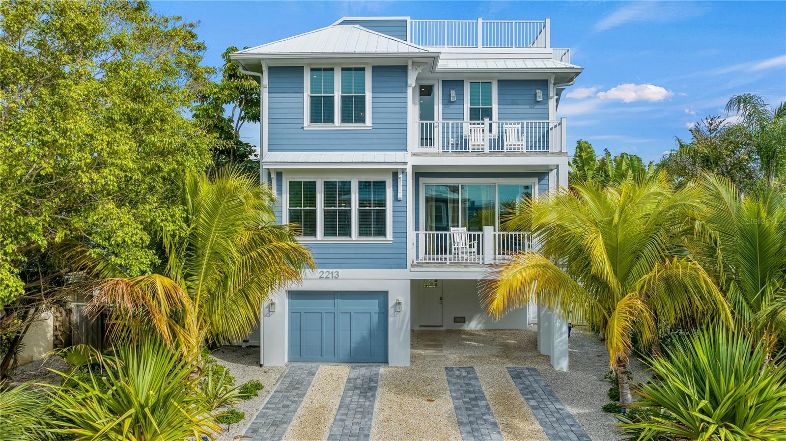 Escape to Coastal Luxury and Island Charm

nestled just a leisurely 5-minute stroll from the sun-kissed shores of Bradenton Beach, this newly built luxury home offers the ultimate coastal retreat. Boasting an impressive seven bedrooms and seven and a half bathrooms. Highlights include a dazzling private pool, rooftop deck, and a secluded hot tub for serene relaxation. Located in a tranquil neighborhood, this multi-level haven promises a blend of modern elegance and island charm.

A Home Designed for Relaxation and Entertainment
Step inside and discover a bright and airy second-floor open floorplan, ideal for entertaining. The living area features plush seating, a large flat-screen TV, and sliding patio doors that flood the space with natural light. The gourmet kitchen is a chef’s dream, complete with high-end appliances, custom cabinetry, and quartz countertops, along with a spacious island offering bar seating. Gather in the sunny dining room or head to the covered patio, where the sound of poolside fountains creates the perfect ambiance. 

Each of the seven bedrooms is thoughtfully designed to provide a restful retreat:

Primary Suite: Balcony access, ample storage, and a modern ensuite with double vanities, a walk-in shower, and a soaking tub.
Second Bedroom: Ensuite with a walk-in shower.
Third, Fourth, and Fifth Bedrooms: Spa-like ensuites, walk-in showers, and private balconies via sliding doors.
Sixth Bedroom: Quiet and cozy with an ensuite and walk-in shower.
Seventh Bedroom: Designed with younger guests in mind, offering space for games and an ensuite with a shower/tub combo.
A convenient third-floor dry bar with a refrigerator ensures easy access to snacks and beverages throughout your stay.

Outdoor Paradise
Step outside to your private oasis, where a sparkling pool, jetted spa, and grill await. Enjoy meals on the shaded patio or relax under the stars on the rooftop deck, taking in the coastal breezes.

Explore Island Life
This home places you in the heart of island adventures. Hop on the complimentary AMI Trolley to discover the vibrant shops and restaurants at the island's North End. Rent bikes, kayak the bay, or simply soak up the sun along the seven-mile coastline.