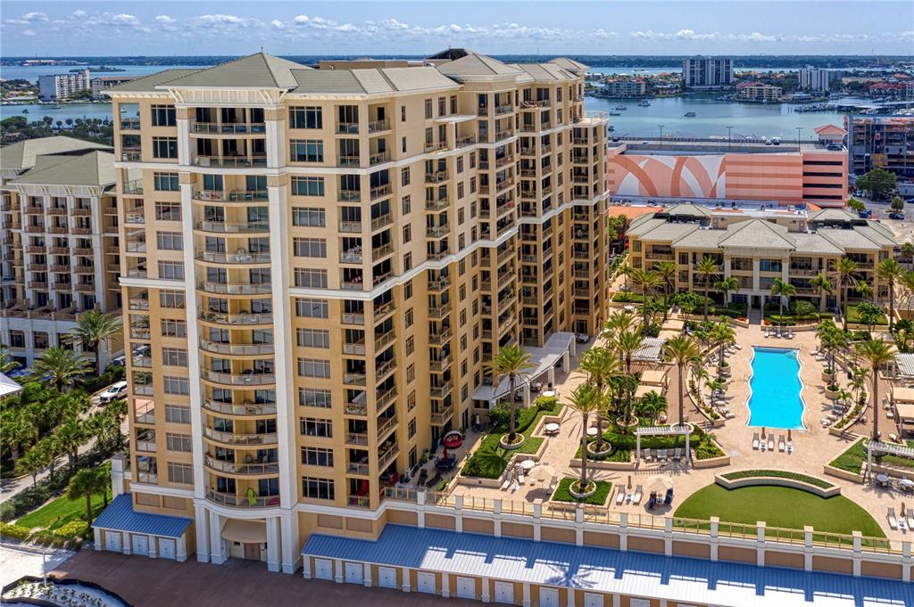 It's not just the sunsets and pure clean sand beaches, although those are spectacular on Clearwater Beach.  It's the ability to enjoy those natural joys from your own personal retreat in the luxurious Sandpearl Residences.  Rarely does a property like this come along, boasting upgrades such as travertine flooring throughout the residence, the finishing touch of crown molding, the ease of electric shades on the great room, kitchen, dining room, and master bedroom windows.  Mirrors enhance the impact of the entryway as well as give outside views from all angles, and even the bathing experience is lifted with upgraded showers.  Newer Air Conditioning units as well as newer washer and dryer will ensure peace of mind for years to come.  Enjoy all that the newly renovated Sandpearl Residences has to offer including beach view ozone purified pool and hot tub, outdoor grills, billiard room, fitness center with sauna and steam, community room, assigned covered parking, 24 hour concierge/security, even Room Service from the world famous Sandpearl Resort just next door.  You deserve to own your special paradise, so take advantage of this opportunity in the short time that it will be available!